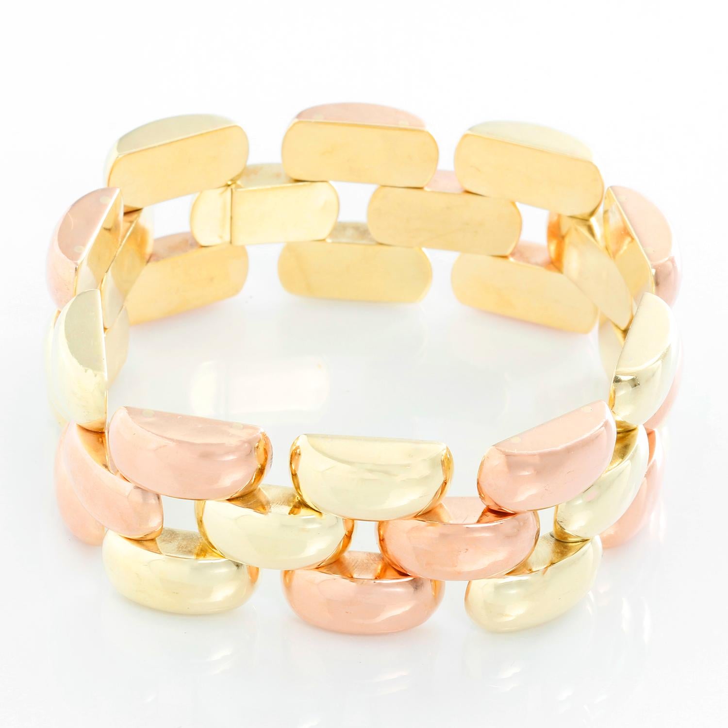 This beautiful bi-color bracelet features 14k yellow and rose gold. It is apx. 7-inches in length and 7/8-inch in width with a total weight of 39.7 grams.