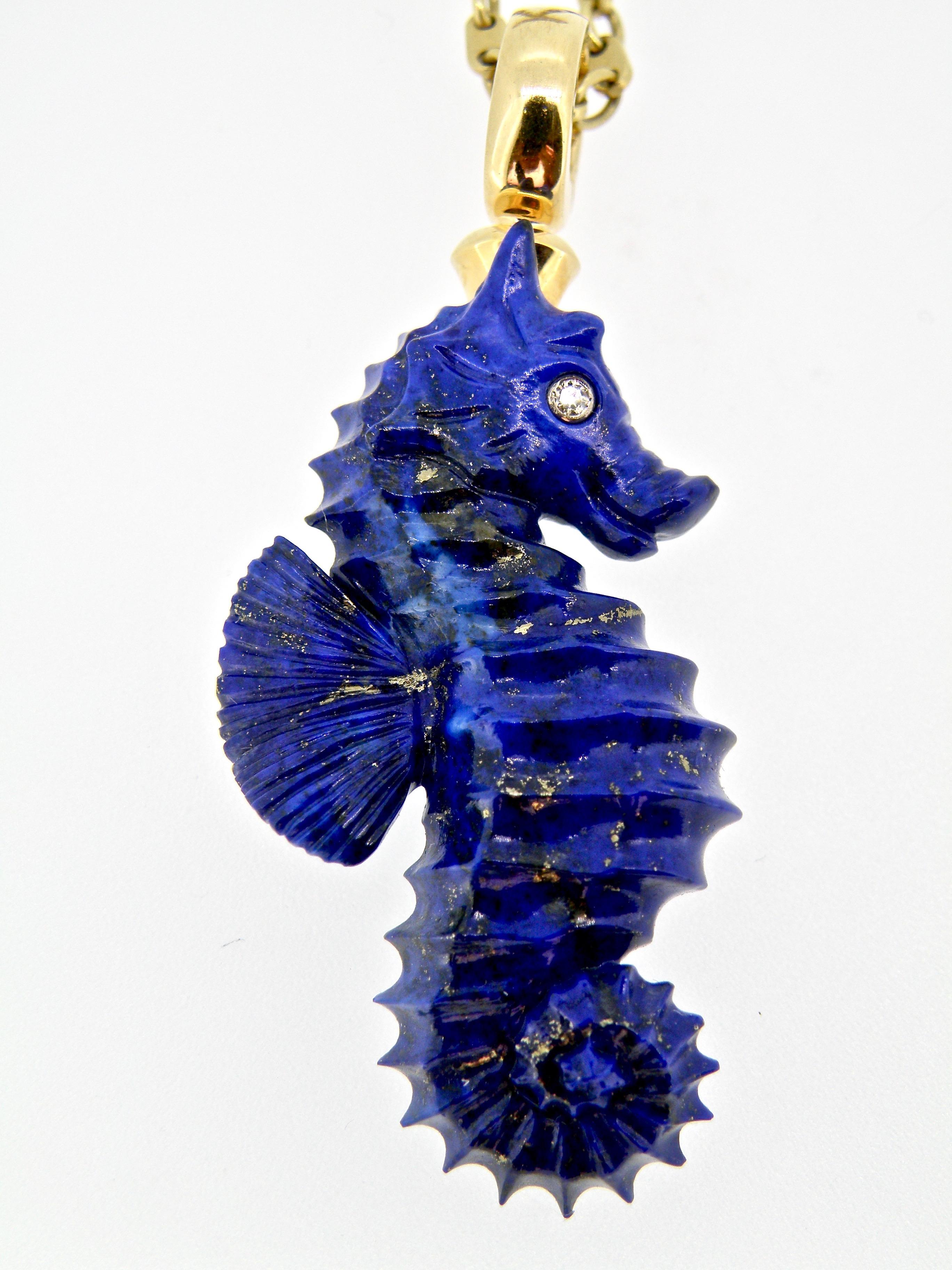 Beautifully carved 2 sided Lapis Lazuli Seahorse. Exquisite Gold Pyrite Veining 18K bail and diamond eyes 