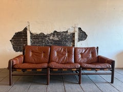 Beautiful Unique Mid century low sling leather safari 3 seat sofa by Bruksbo