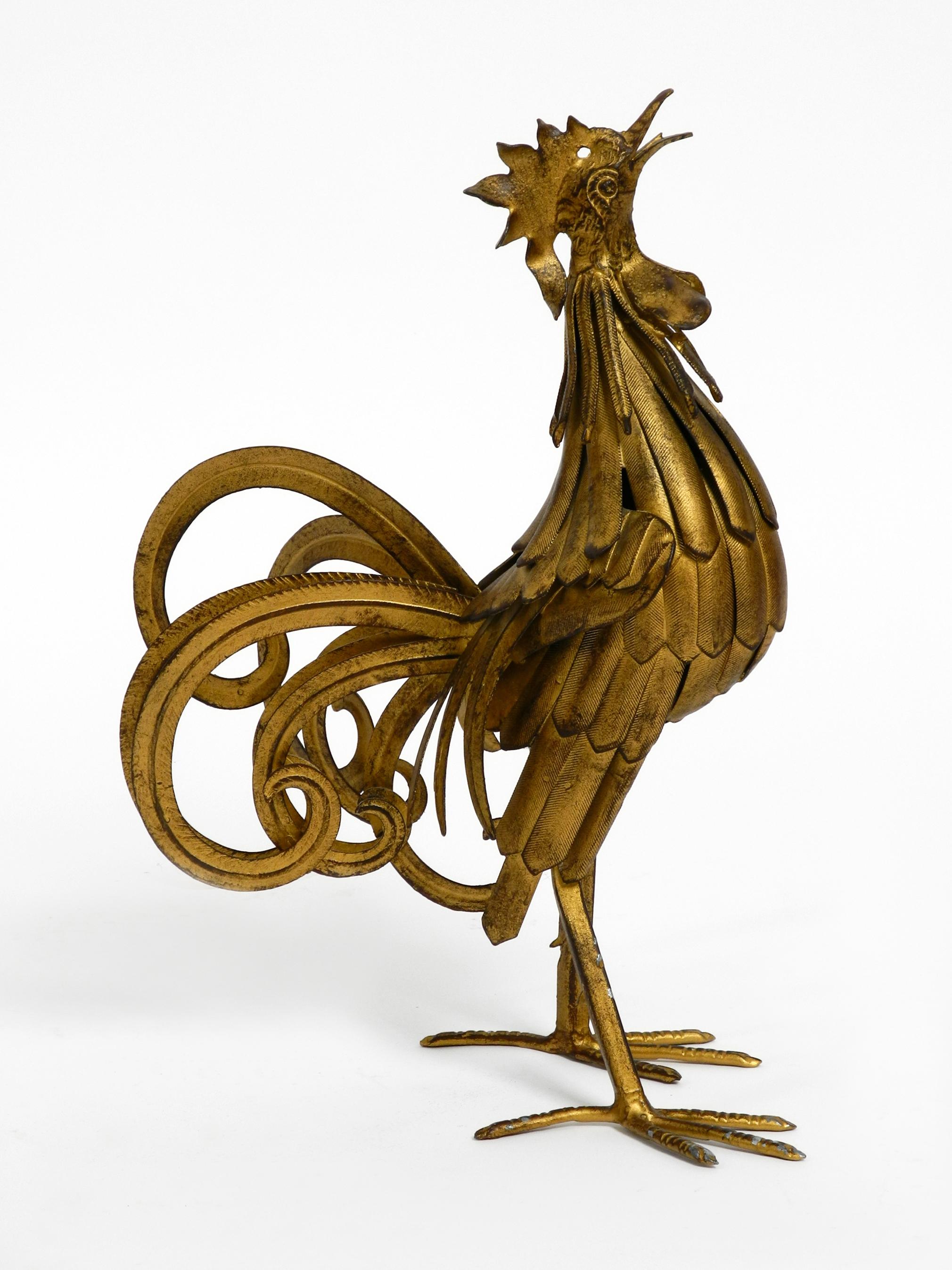 Very nice 1930s big heavy rooster as decoration.
Made in Germany. Made of solid metal anodized with brass.
Very good with lots of details. With a nice patina. 
No damages, nothing is missing or is shaky.
Great decoration for all residential