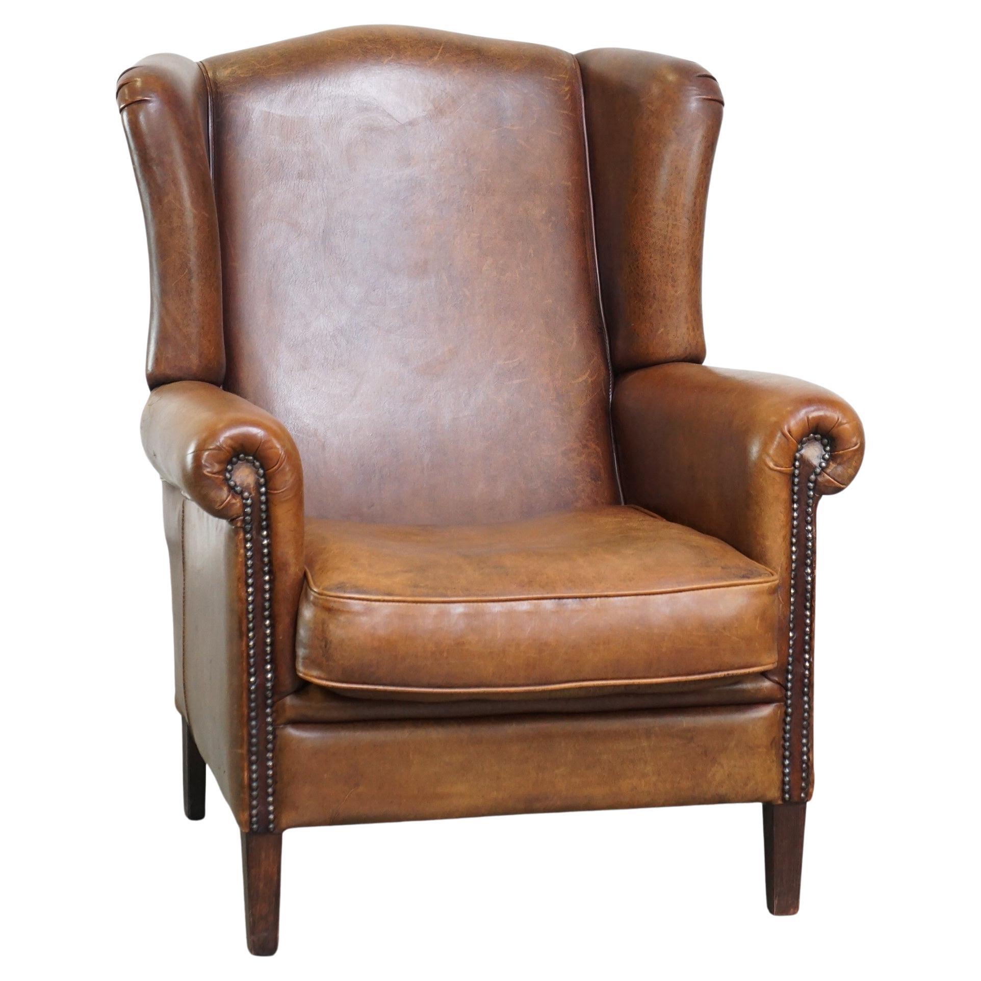 Beautiful, very comfortable, cognac-colored, sheepskin wing chair