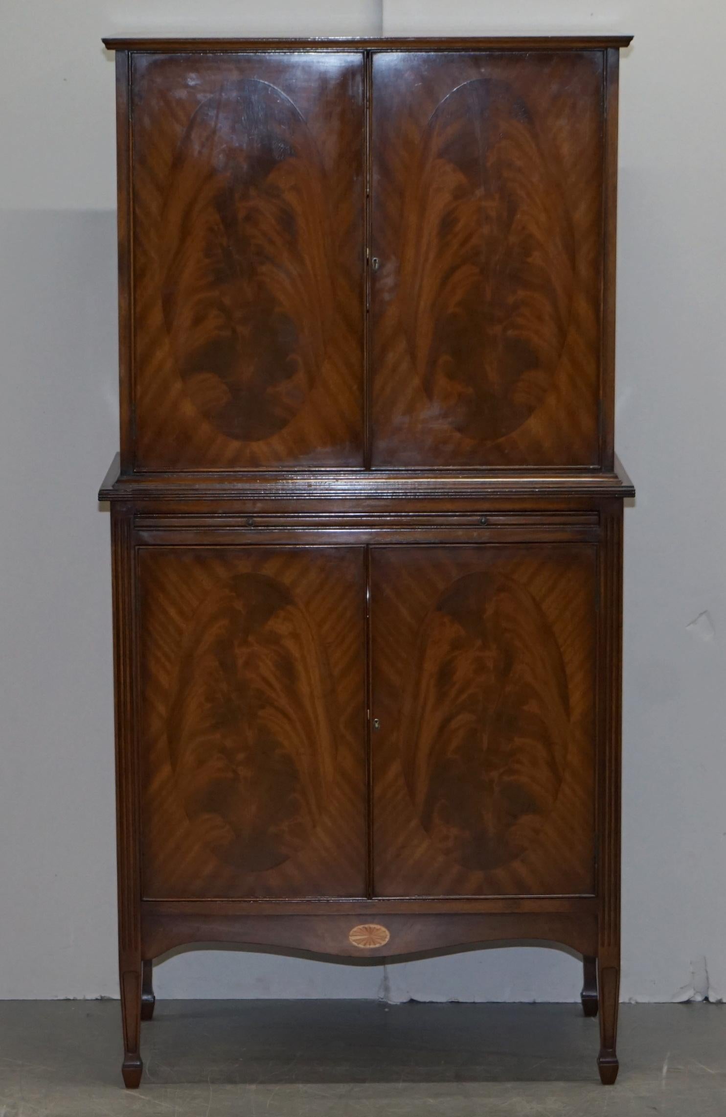 We are delighted to offer for sale this very well made flamed mahogany & satinwood drinks cabinet with glass topped butlers serving tray made in the Sheraton Revival style

A very well made and good looking drinks cabinet, the inside is pure