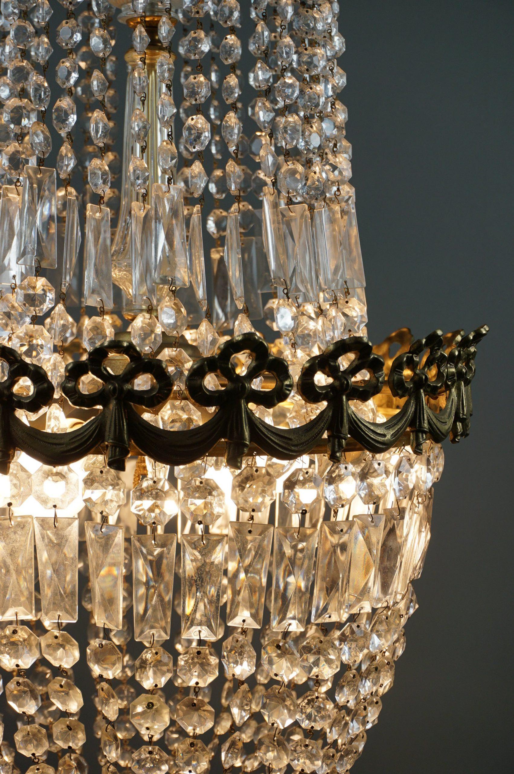 Offered is this antique chandelier full of icicles.

Insanely richly decorated classic chandelier. The crystal pendants attached to it give the chandelier its elegance.
This pocket chandelier is made of beautiful crystal and has gold edges. giving