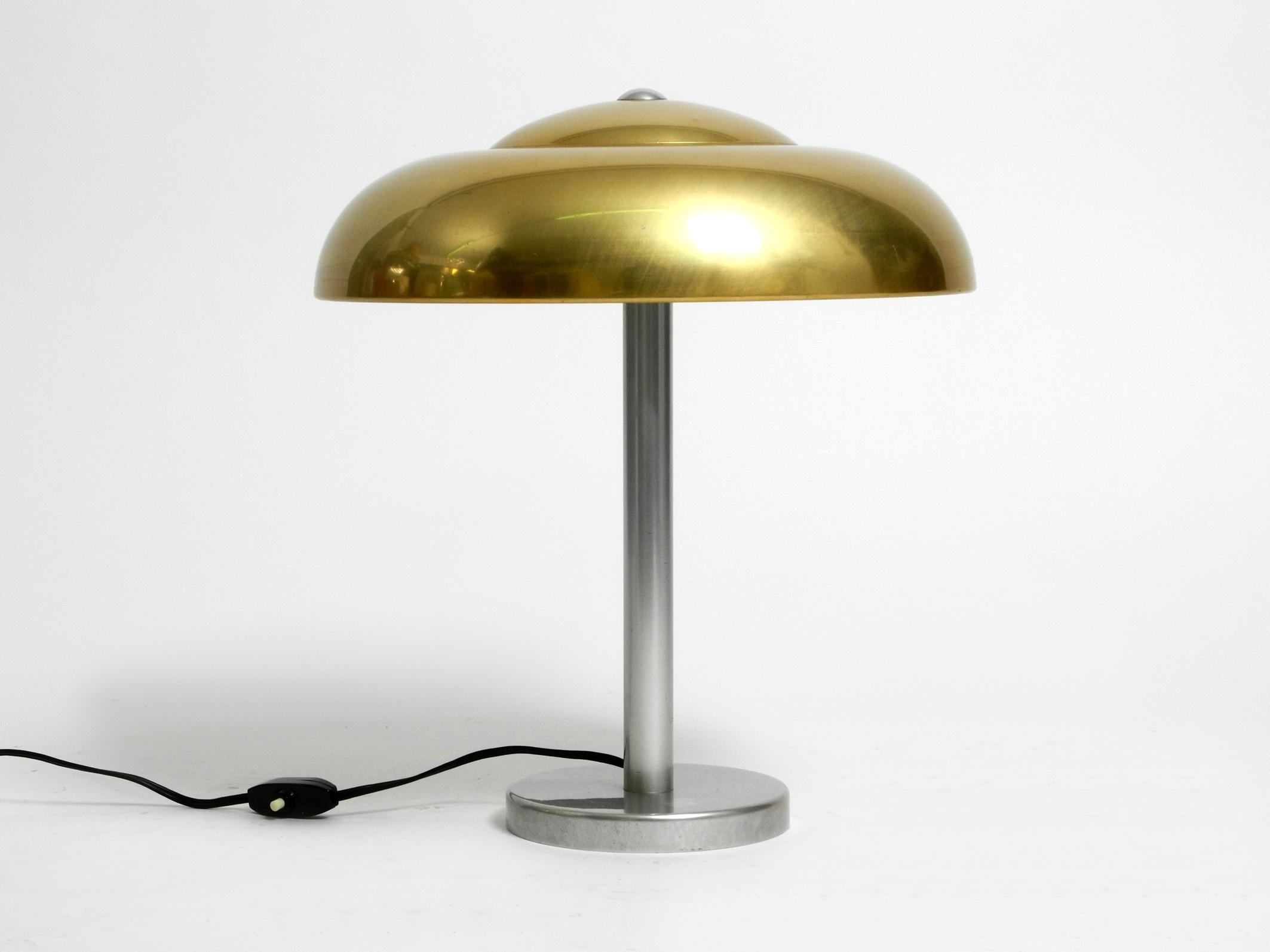 Beautiful extremely rare large WMF Ikora table lamp from the 1930s.
In a very good vintage condition. Minimalist and very beautiful German design.
The shade is made of aluminum and is anodized in a color like brass on the outside.
With polished