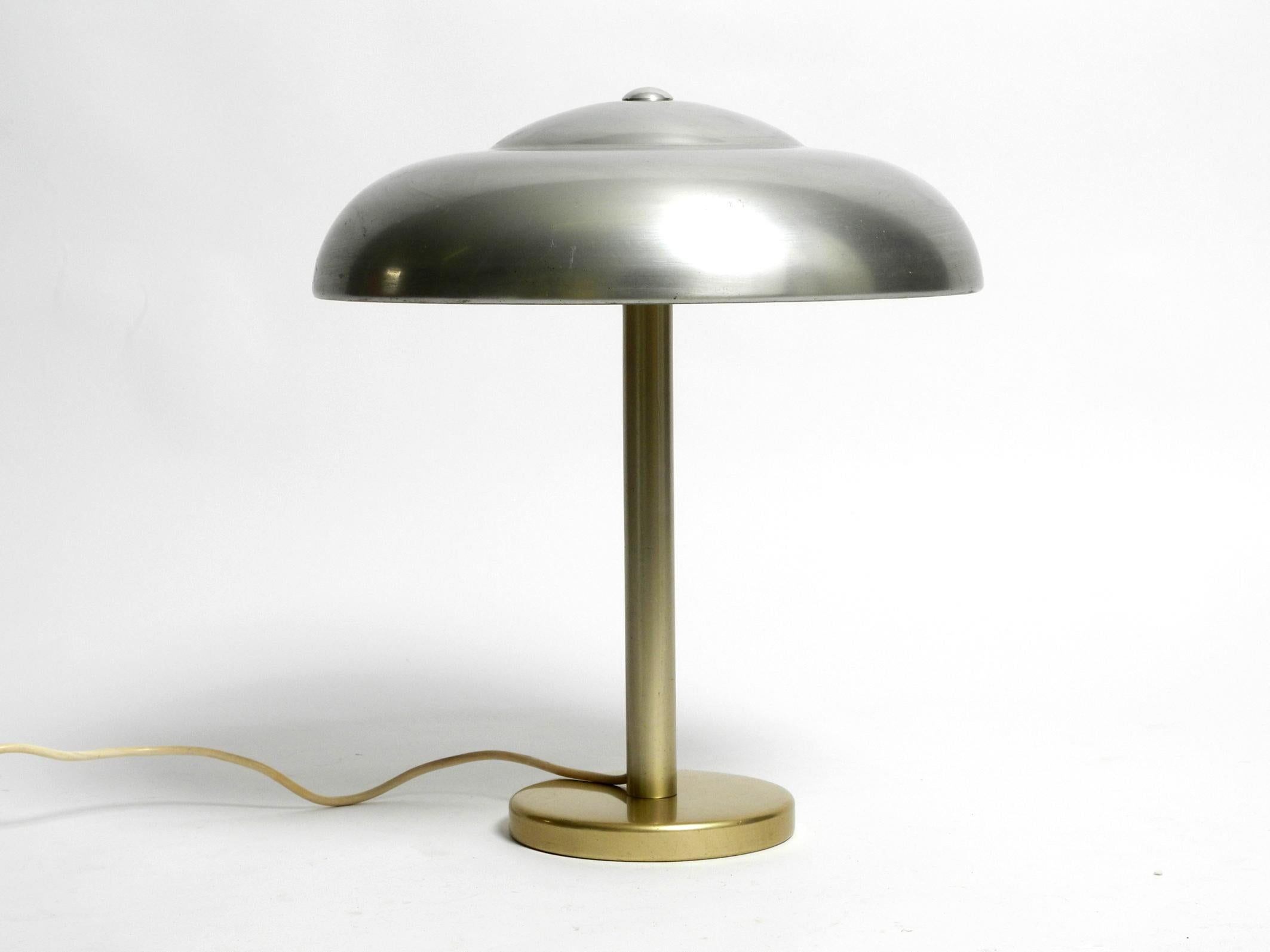 Beautiful extremely rare large WMF Ikora table lamp from the 1930s.
In a very good vintage condition. Minimalist very beautiful German design.
The shade is made of anodized aluminum.
Polished solid aluminum base and neck anodized in brass