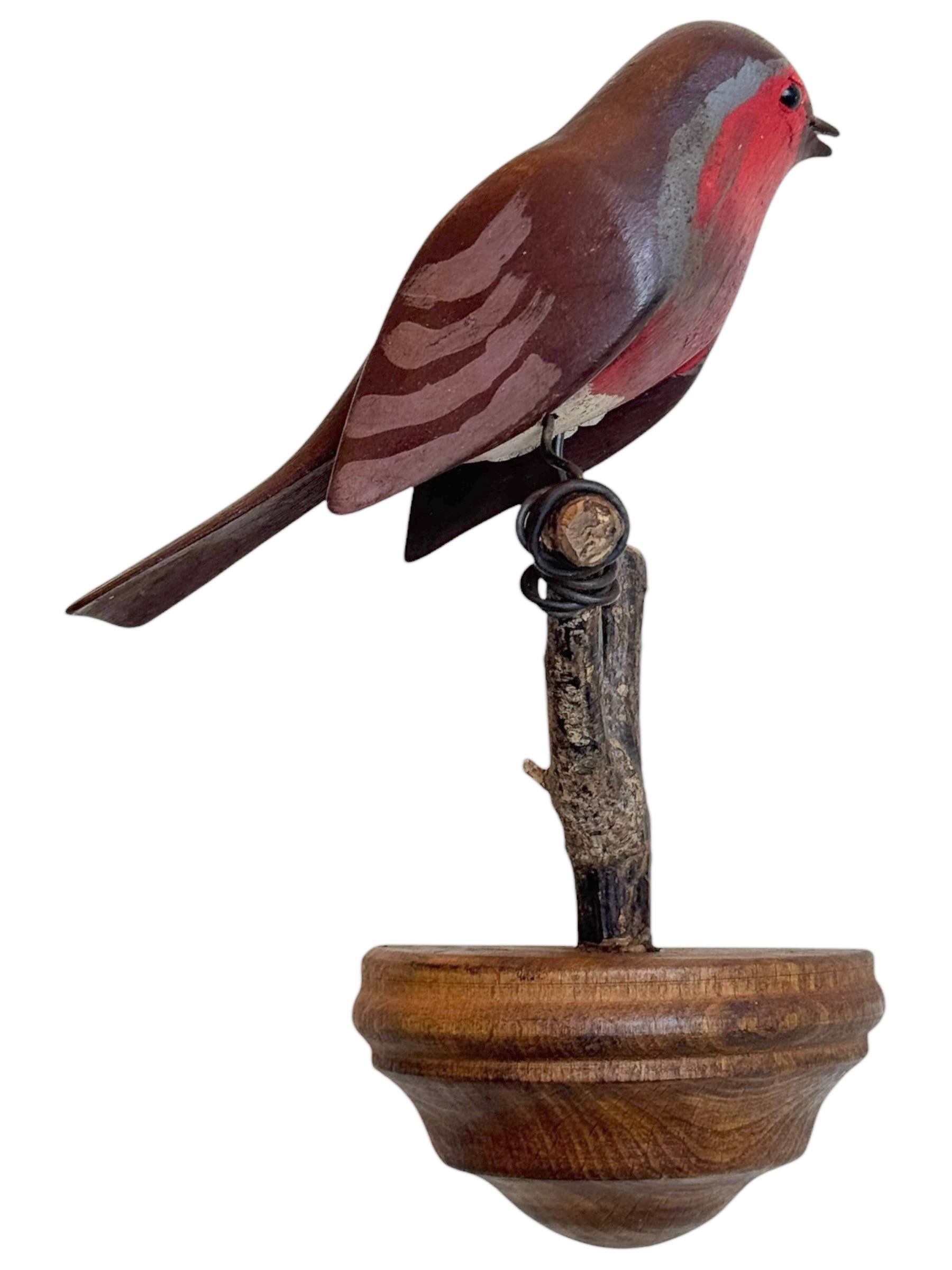 A beautiful Austrian 20th century, carved wood bird, mounted on a stand for hanging. The tradition of these in Austria called 