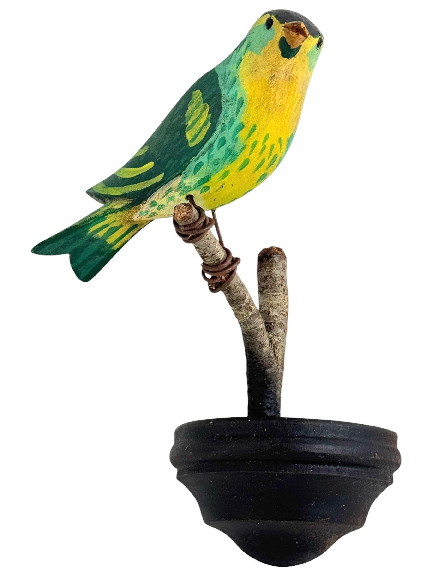 A beautiful Austrian 20th century, carved wood bird, mounted on a stand for hanging. The tradition of these in Austria called 