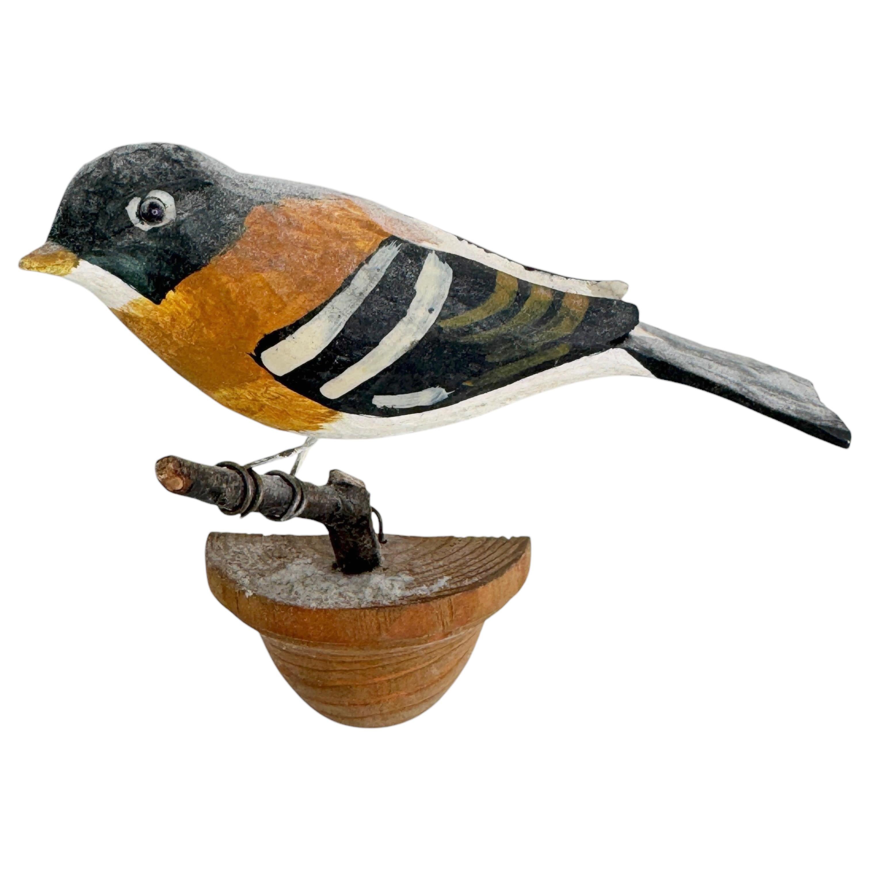 A beautiful Austrian 20th century, carved wood bird, mounted on a stand for hanging. The tradition of these in Austria called 