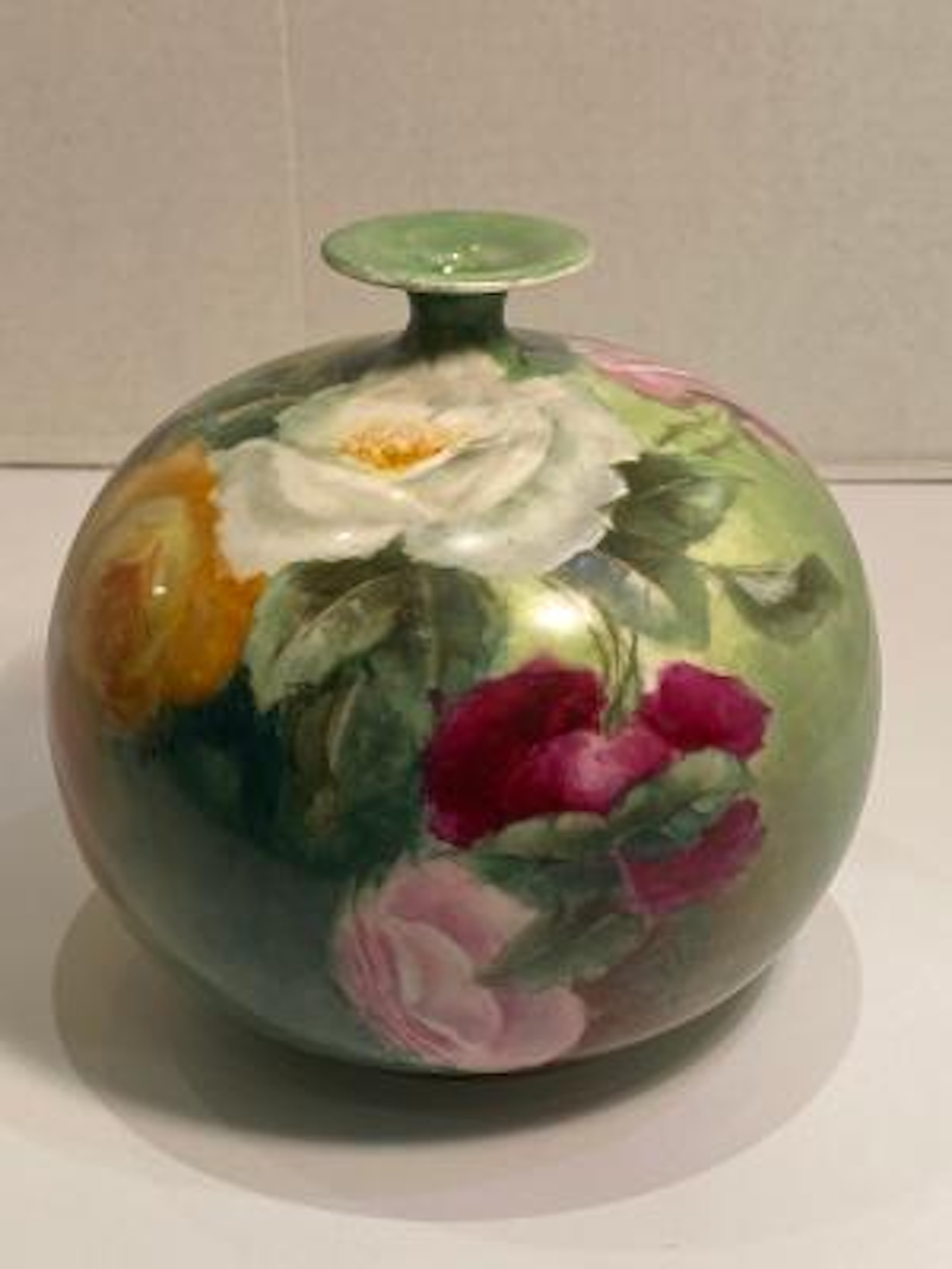 Exquisitely handmade and hand painted, turn of the century Victorian era antique porcelain vase features gorgeous, life like roses in full bloom, rosebuds and leaves, rendered in the naturalistic floral style popular in late nineteenth and early