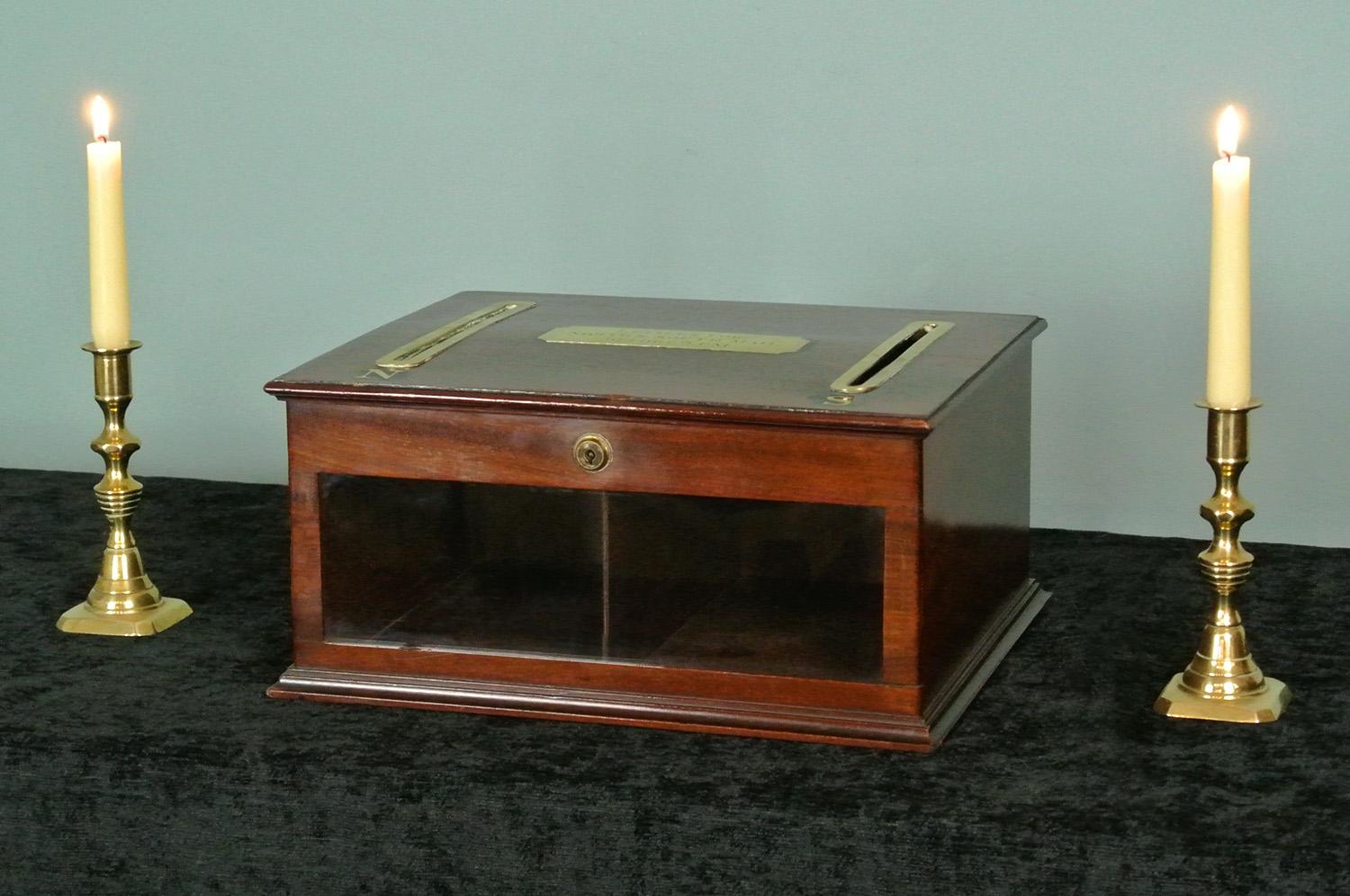 A rarely seen original Victorian letter box of excellent quality. Glass fronted, with brass slots in the top with ebony inlays and brass letters 'N' and 'S' and original working lock with key. Original brass hinges and polished mahogany lining with