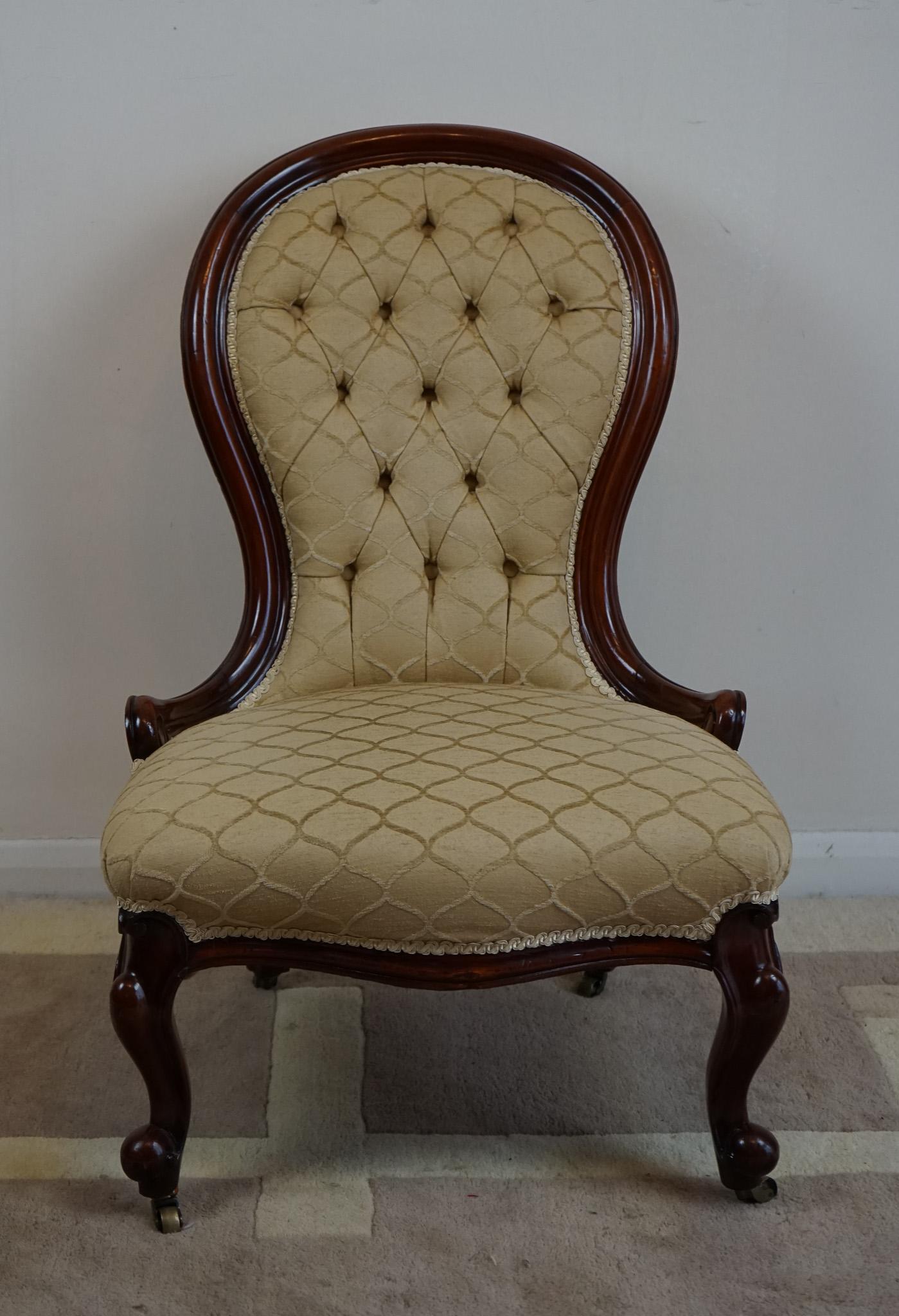 This is a classic Victorian, antique salon lady’s chair dating to the mid 19th century, c.1840. 
Raised on stout, oblique cabriole legs
Featuring bulbous knee and scrolled toe
Swept and shaped rear legs
Serpentine front seat rail
Dished and