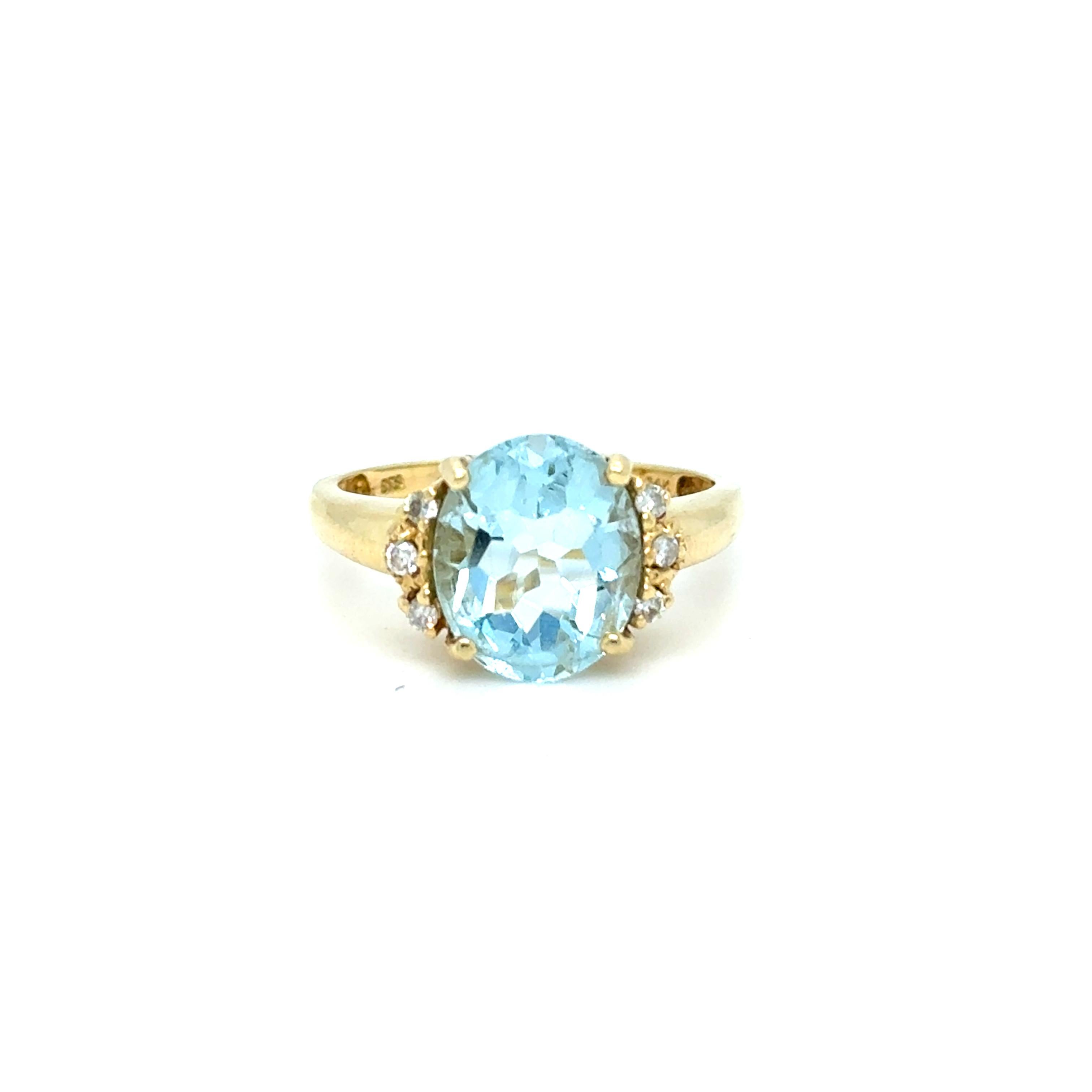 This Vintage Aquamarine and Diamond Cluster Ring is a beautiful classic! Crafted in 14K Yellow Gold, the design features a gorgeous Natural Aquamarine center, with Accent Diamonds on each side! In the center, the ring holds One Natural Aquamarine,