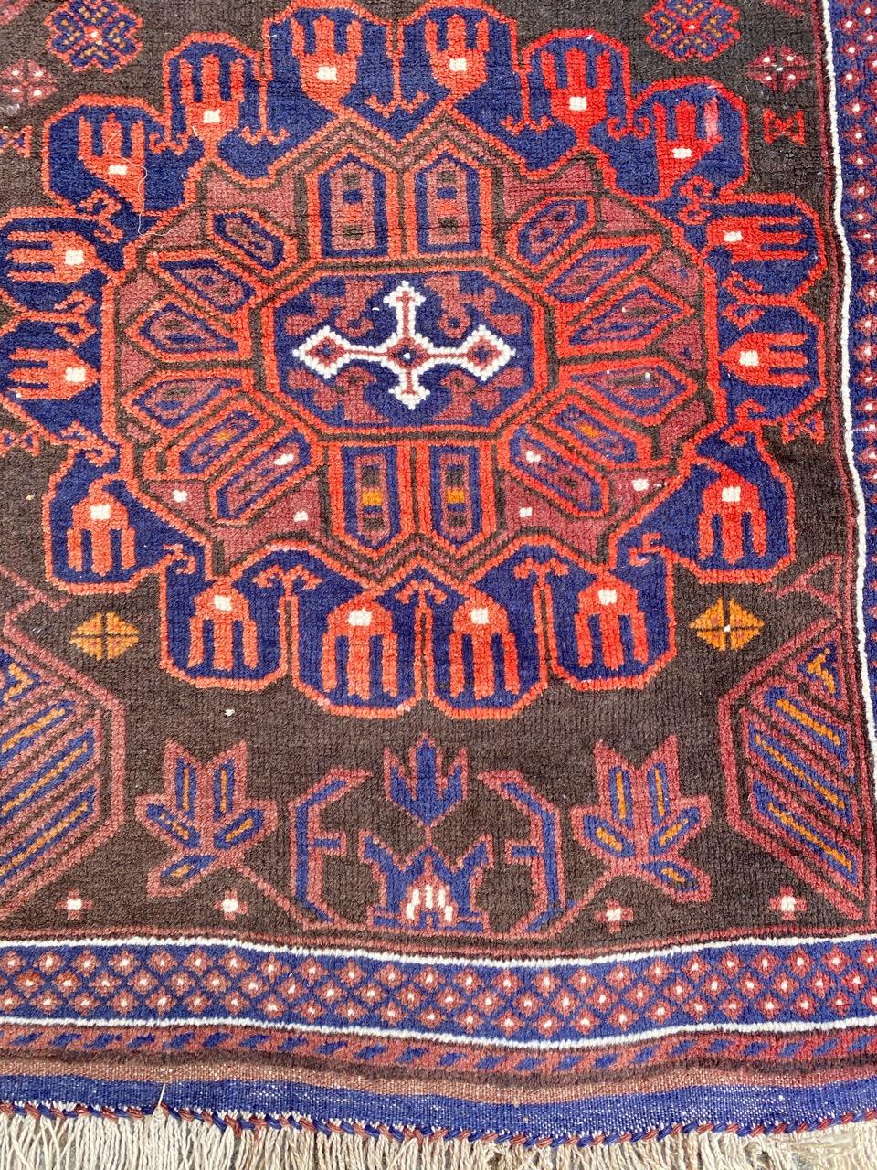 Nice mid-20th century Baluch rug with nice tribal design and beautiful colors, entirely hand knotted with wool velvet on wool foundation.