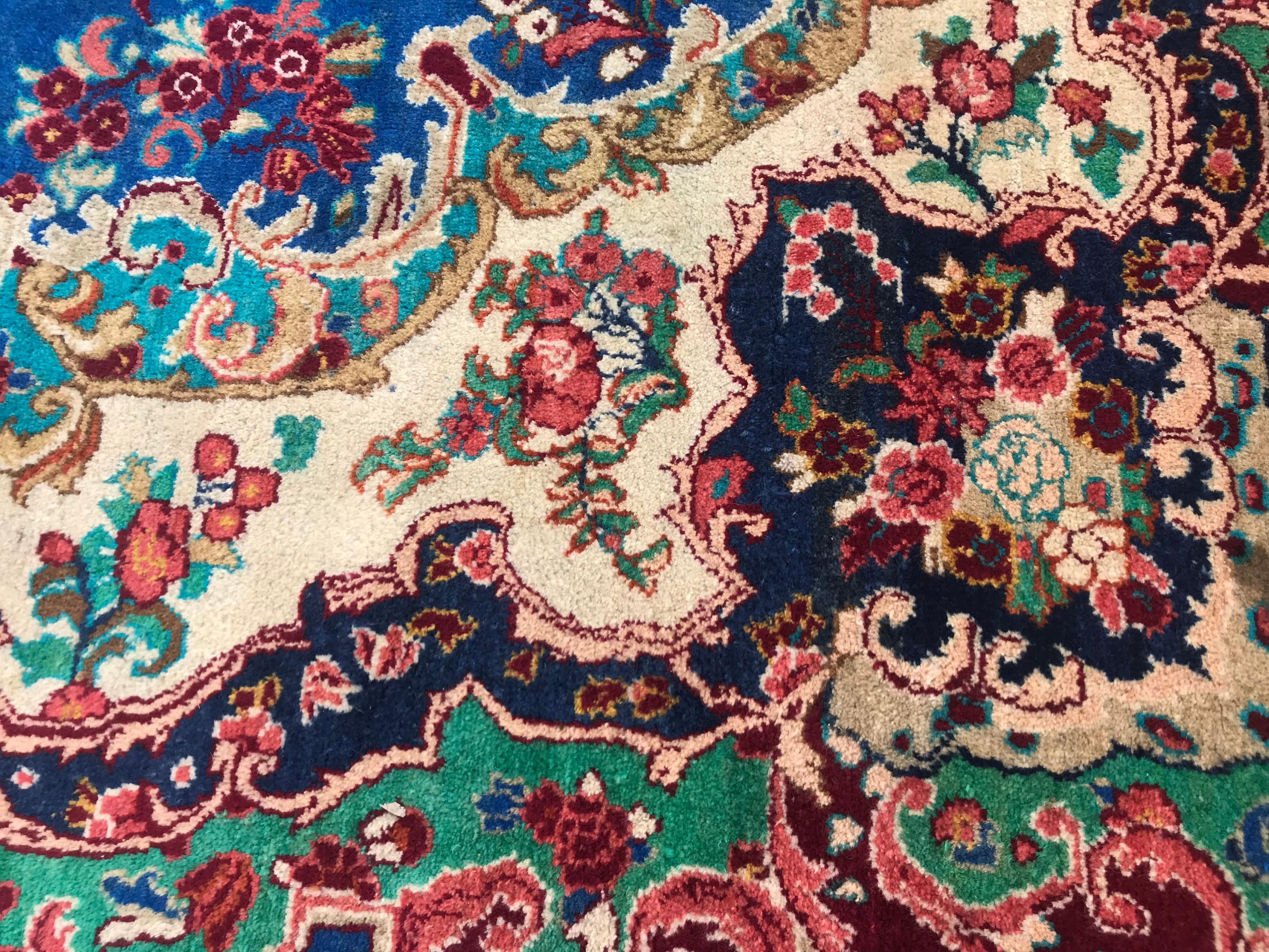 Very beautiful midcentury rug with nice floral design with a nice central medallion, and beautiful colors with blue, orange, green, yellow, purple and red, entirely hand knotted with wool velvet on cotton foundation.