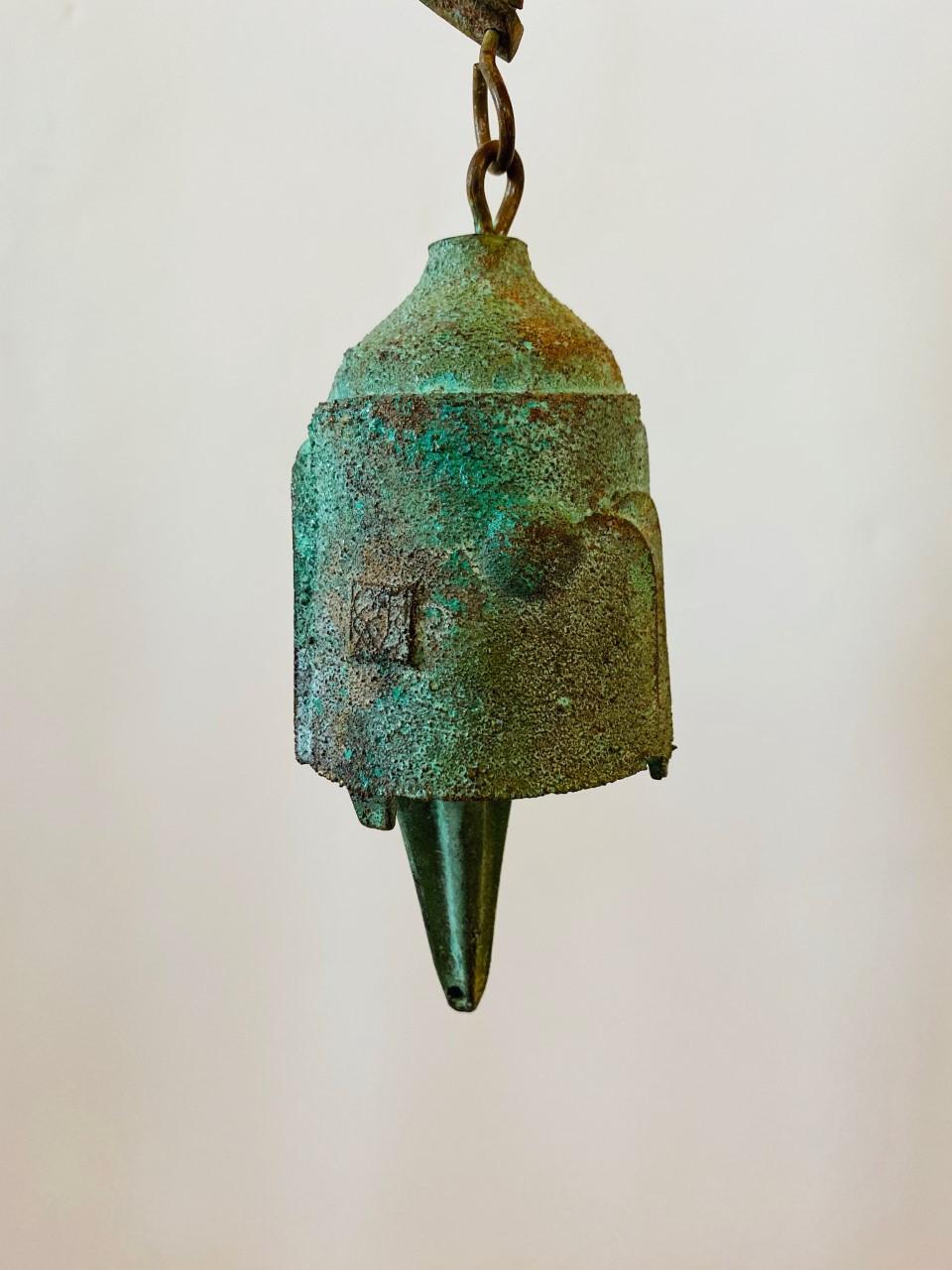Beautiful vintage bronze Cosanti bell by Paolo Soleri. Uncommon shape and design. Fantastic patina and a great sound. Signed. A unique piece from a celebrated artist. Unique attribute to this piece is a bluish green patina.

Paolo Soleri