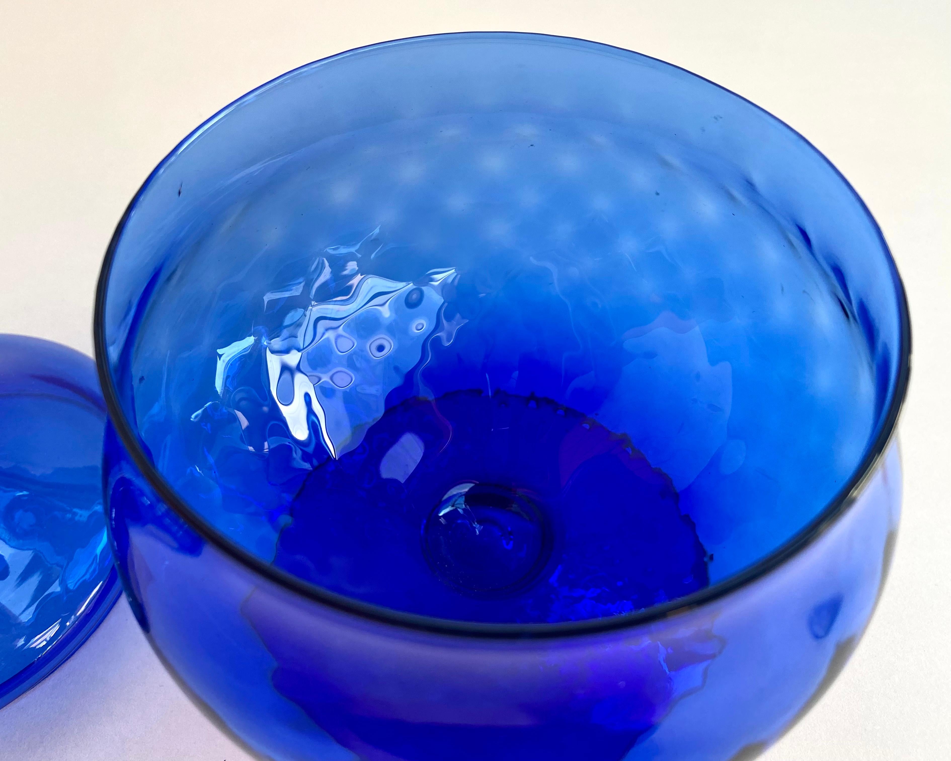 Vintage midcentury jar with lid for sweets in cobalt blue glass with stem.

Italy, 1970s.

Beautiful Vintage Italian Glass. Amazing color and shape. Rare find from the 1970s!

You can use it for candy, trinkets, honey, cookies.

The candy
