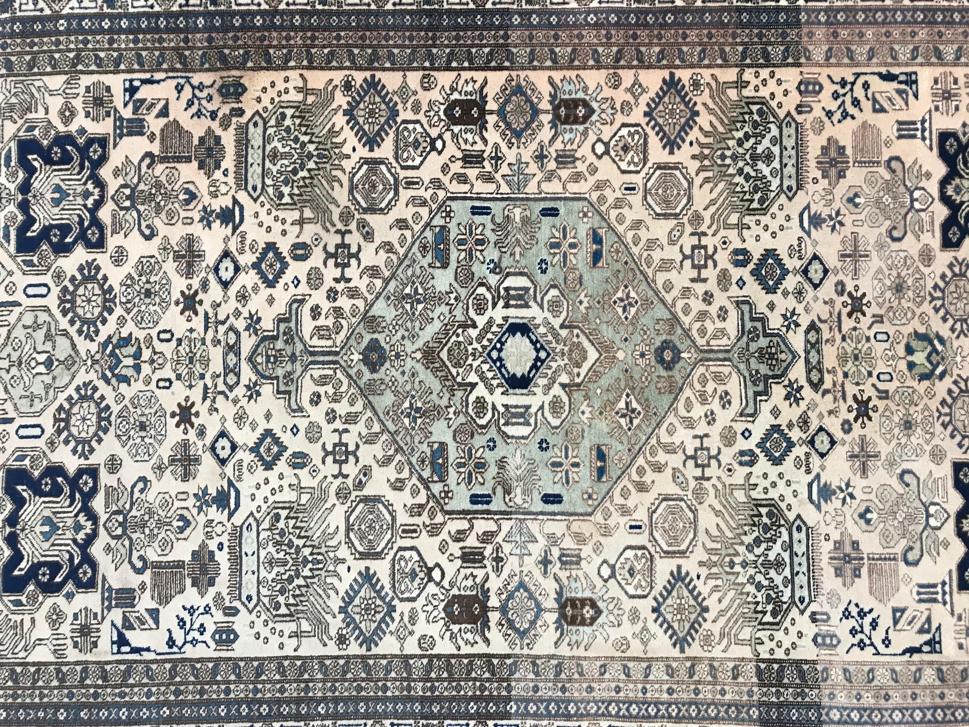 Nice 20th century Shirwan design Azerbaijan rug with a beautiful geometrical and tribal design and light colors with a faded red field, blue, green and brown, finely hand knotted with wool velvet on cotton foundation.
