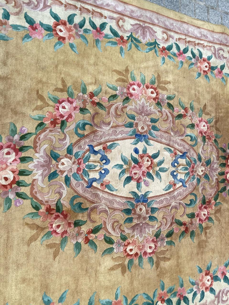 Very beautiful Chinese rug with beautiful floral design and beautiful colors with yellow field, entirely hand knotted with wool velvet on cotton foundation.