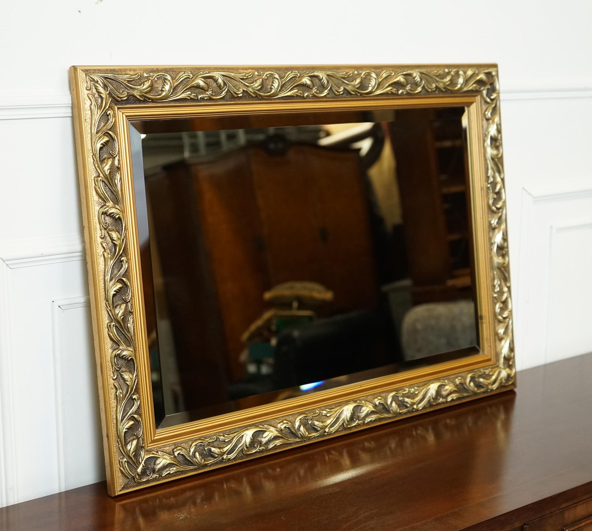 
We are delighted to offer for sale this Beautiful Vintage Giltwood Mirror.

A beautiful cushioned giltwood bevelled mirror is a stunning piece of decor that adds a touch of opulence and grandeur to any space. This mirror embodies the elegance and