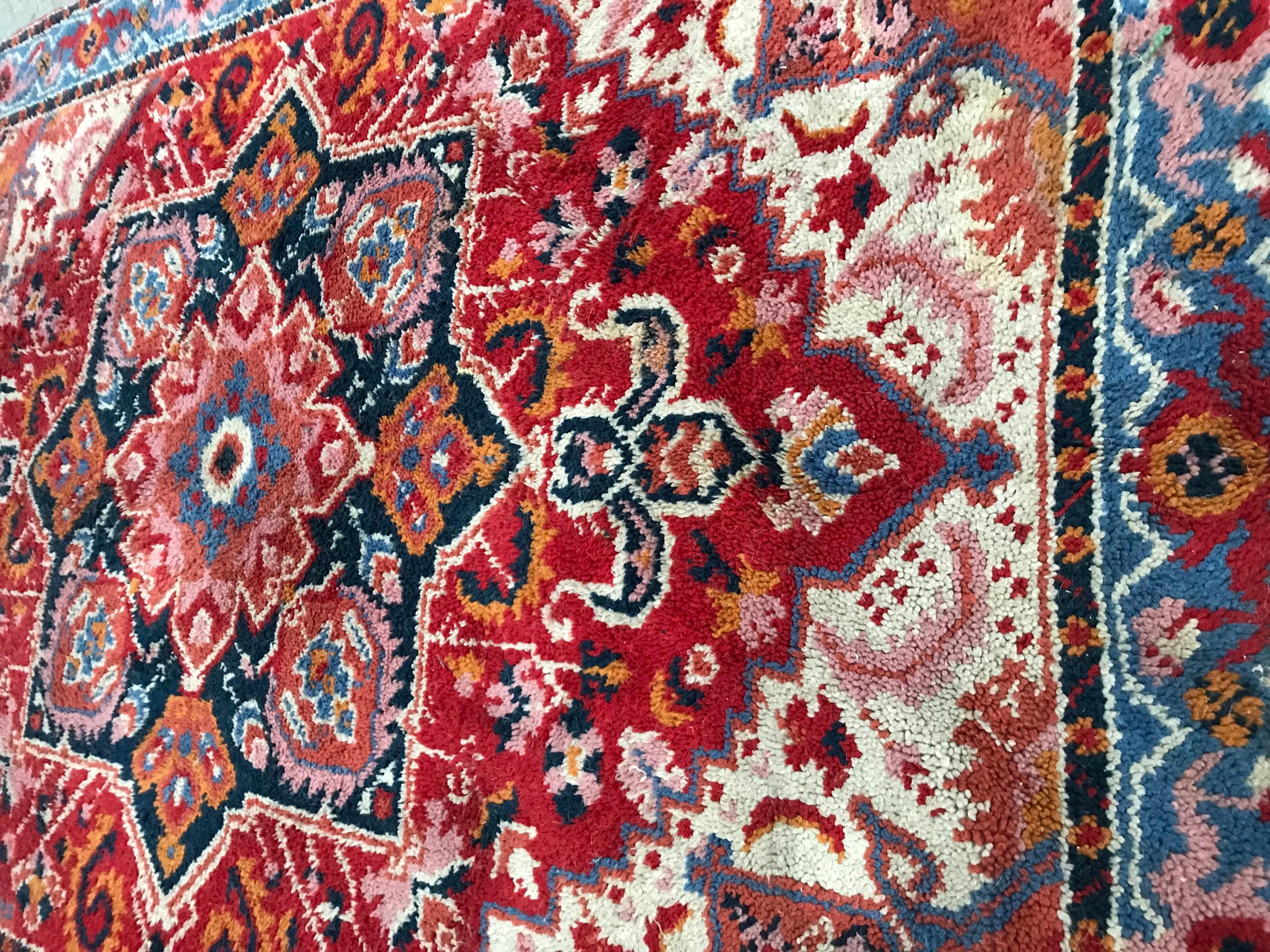 Nice French Cogolin rug with a Persian Heriz design and beautiful colors with orange, red, blue and pink, entirely hand knotted with wool velvet on cotton foundation.