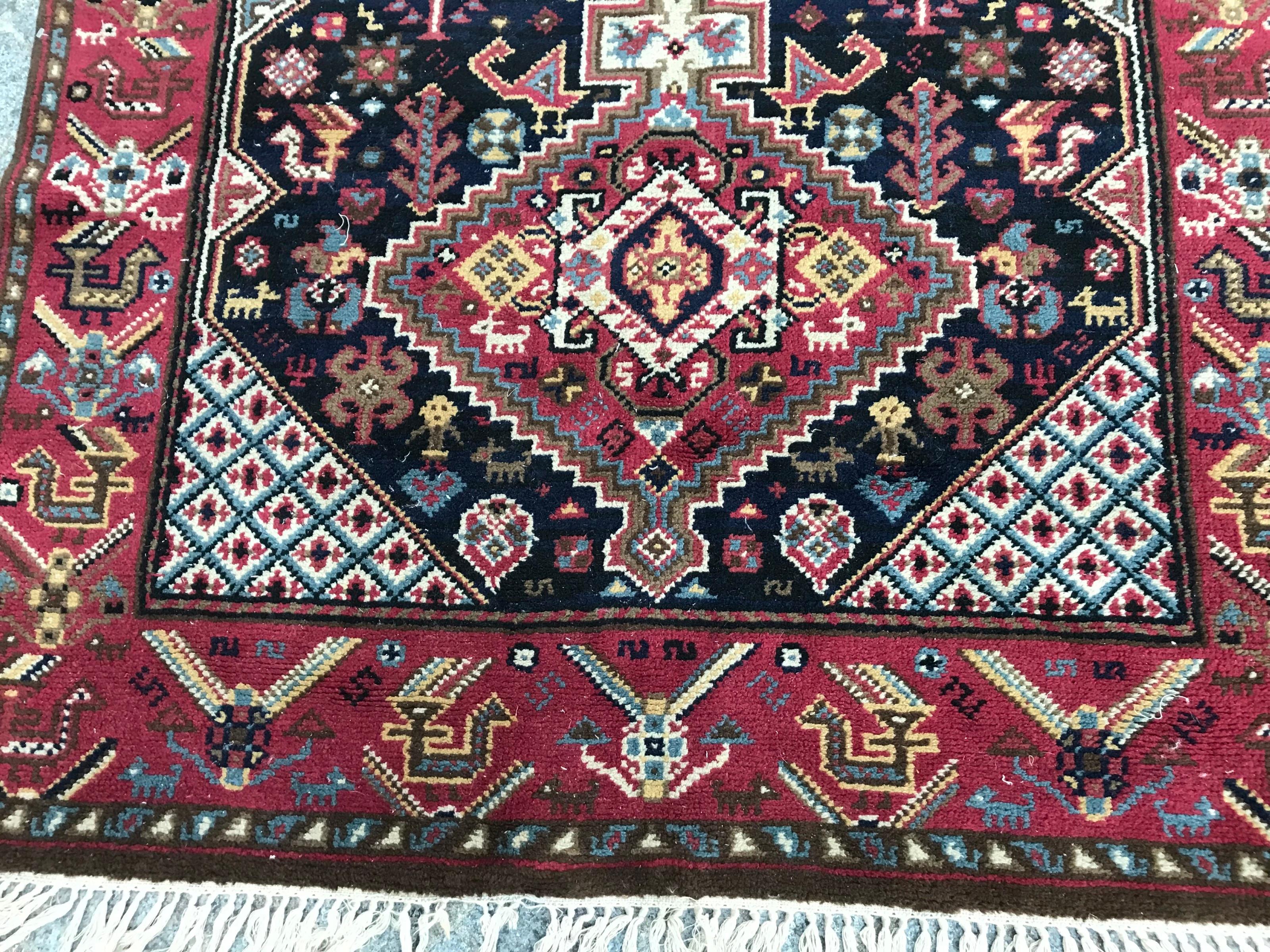 Exquisite mid-20th century French knotted rug featuring the elegance of Shiraz rug design. This masterpiece showcases a captivating blend of geometrical patterns and vibrant colors, meticulously crafted with wool velvet on a cotton foundation.