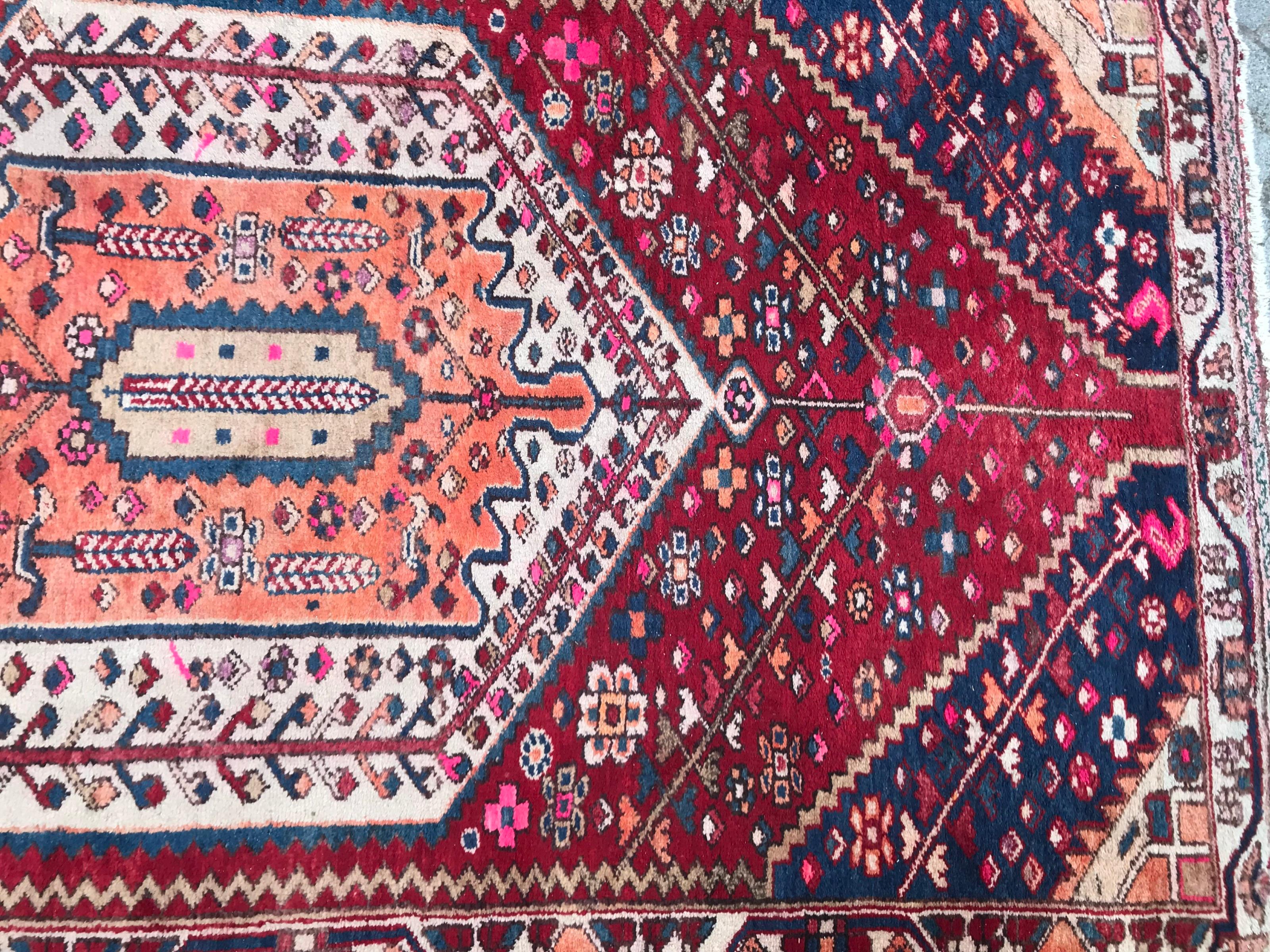 Nice mid-20th century rug with tribal design and nice colors with red, blue, pink and orange, entirely hand knotted with wool velvet on cotton foundation.