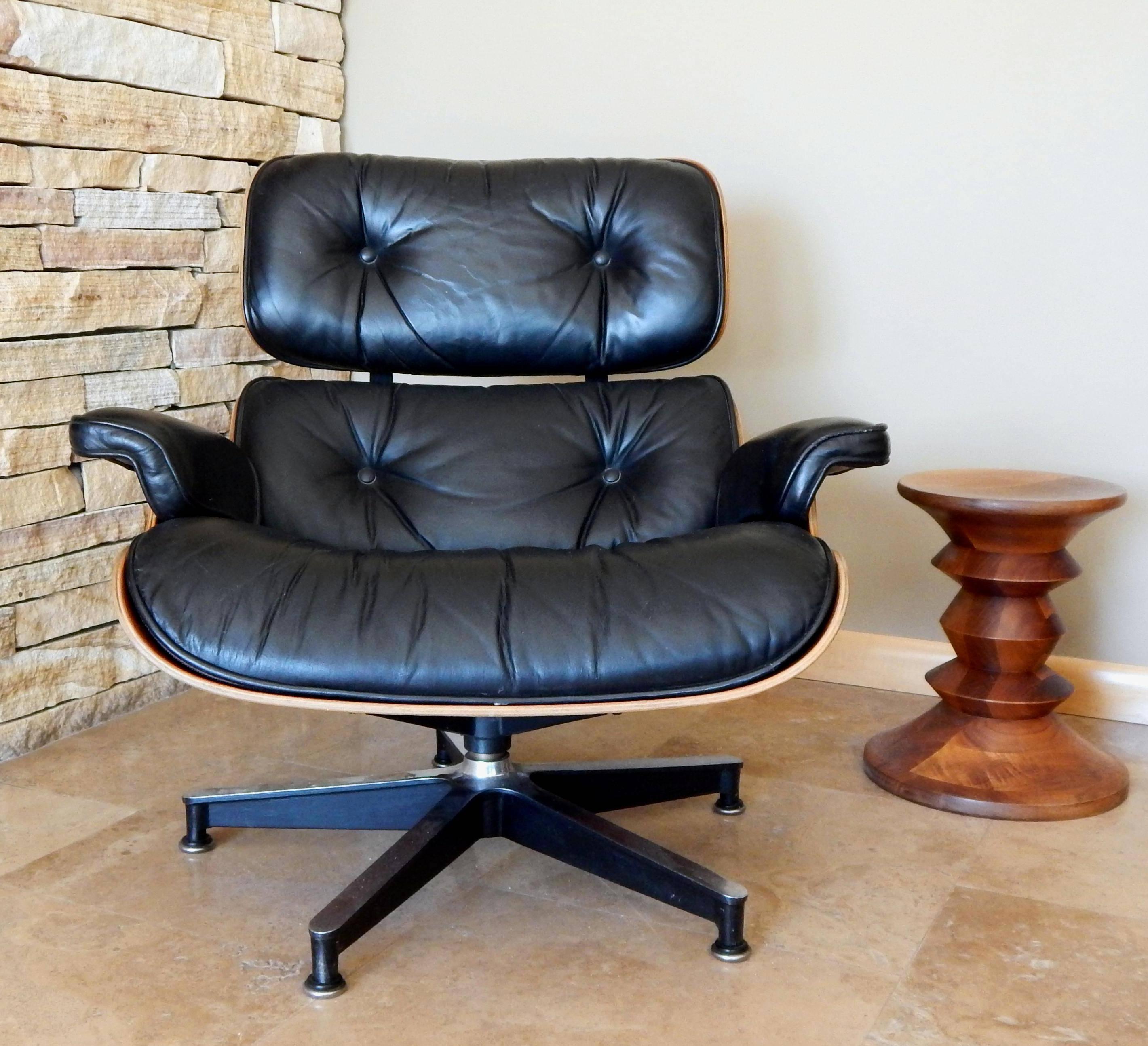 Eames Herman Miller lounge and ottoman in rosewood and leather.
The wood and leather have wear consistent with age
and are both in excellent original condition.
Due to the new CITES regulations concerning exporting Rosewood, I will
not be able to