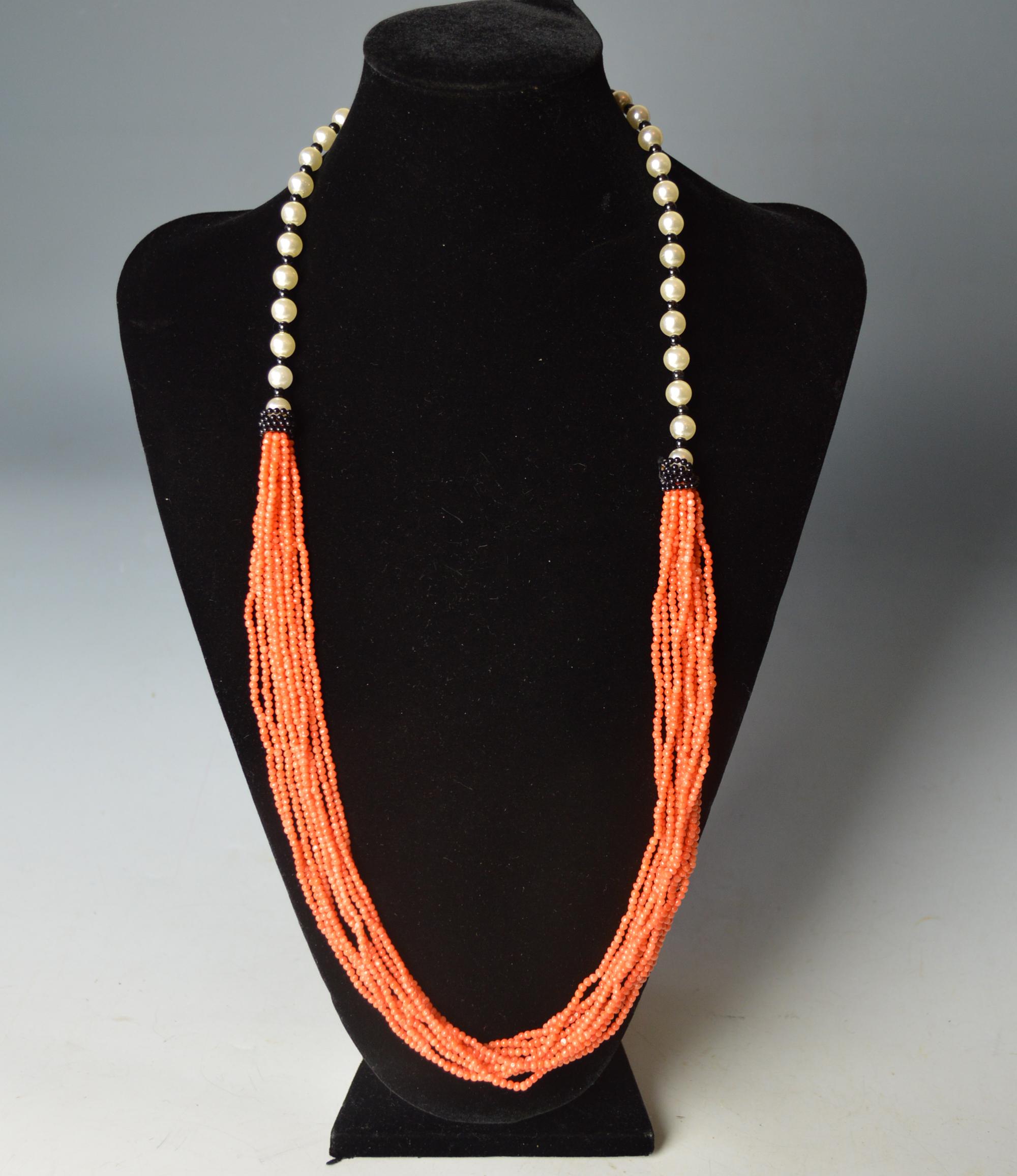 Beautiful Vintage Italian multi strand Seed coral pearl necklace

Real Italian salmon red Coral imitation pearl and black malachite

Italian

Period 1970`s
 