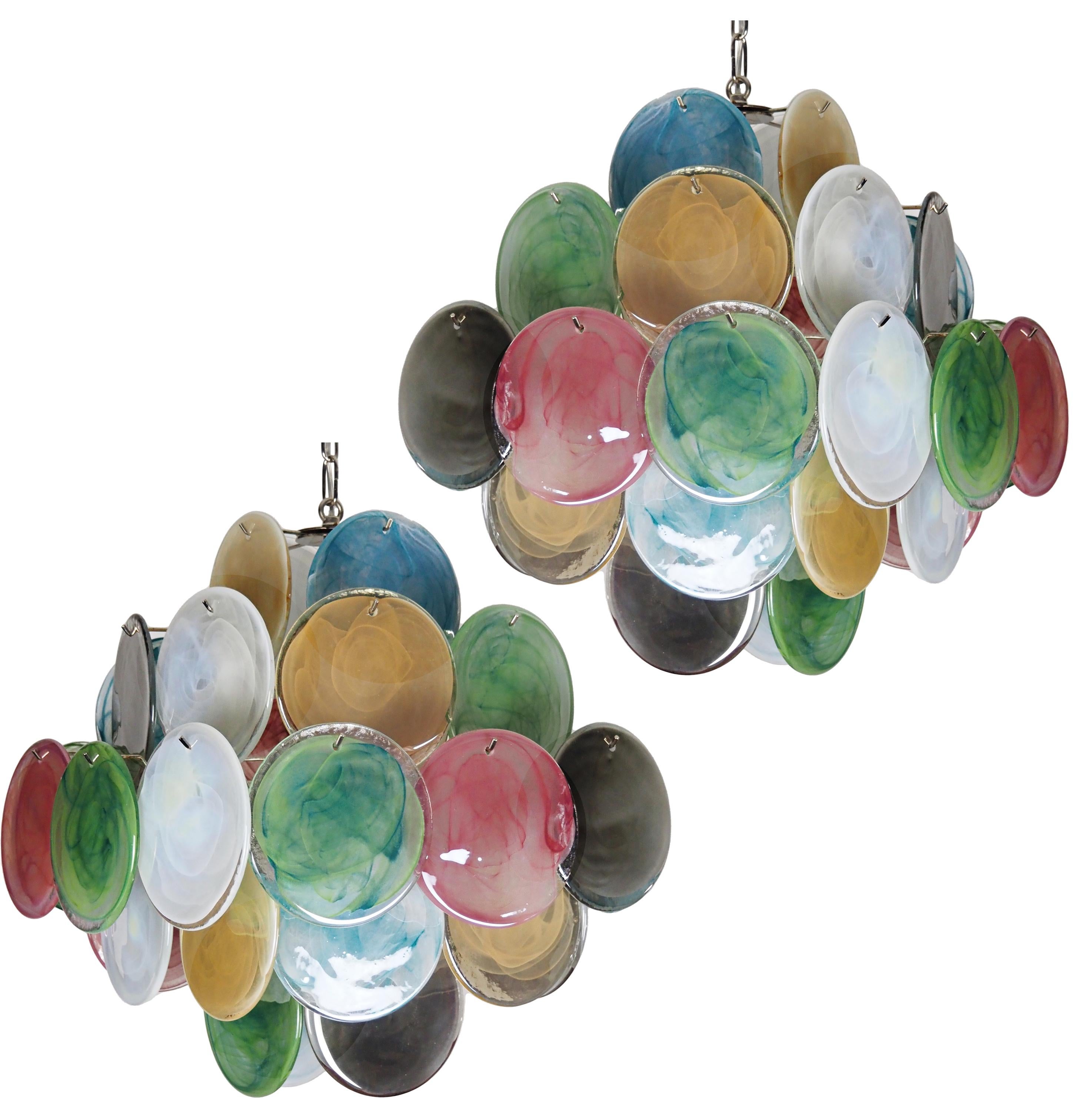 Vintage Italian Murano chandelier in Vistosi style. The chandelier has 36 fantastic multicolored alabaster iridescent glasses in a nickel metal frame.
Period: late XX century
Dimensions: 44,50 inches (150 cm) height with chain; 19,40 inches (50 cm)