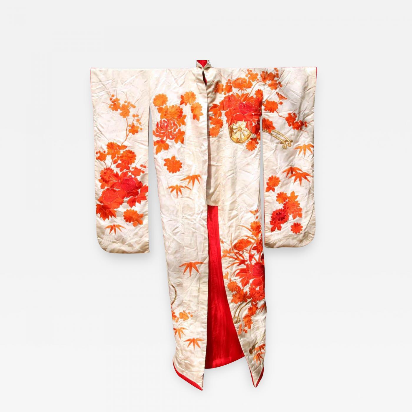 An exceptional Japanese silk wedding ceremonial kimono Uchikake, circa 1930-60s in the oriental Art Deco fashion. Cream white subtly patterned silk background with elaborate and intricate embroidery in orange, red and gold threads that depict