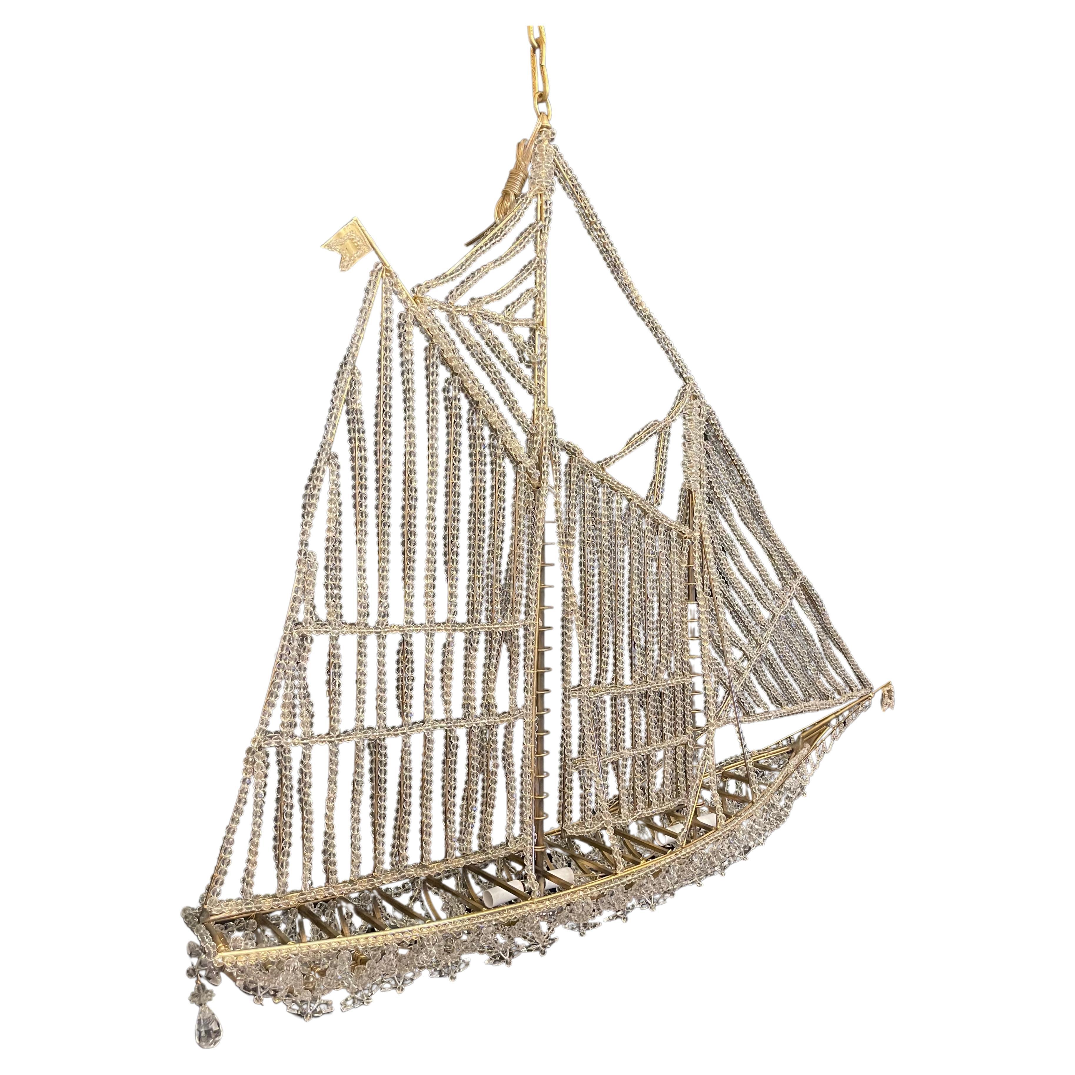 A beautiful vintage very large Italian crystal beaded sail boat chandelier ship fixture with 4 candelabra internal lights
Rewired and ready to install with chain canopy and mounting hardware.
