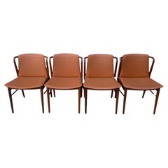 Magnifique ensemble vintage de 4 chaises de salle à manger danoises modernes en cuir de teck