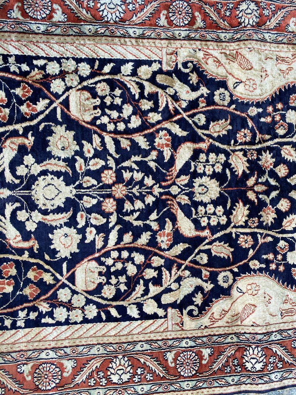 Very nice little silk rug with beautiful floral design and nice colors with blue, orange, beige and brown, entirely and finely hand knotted with silk velvet on silk foundation.