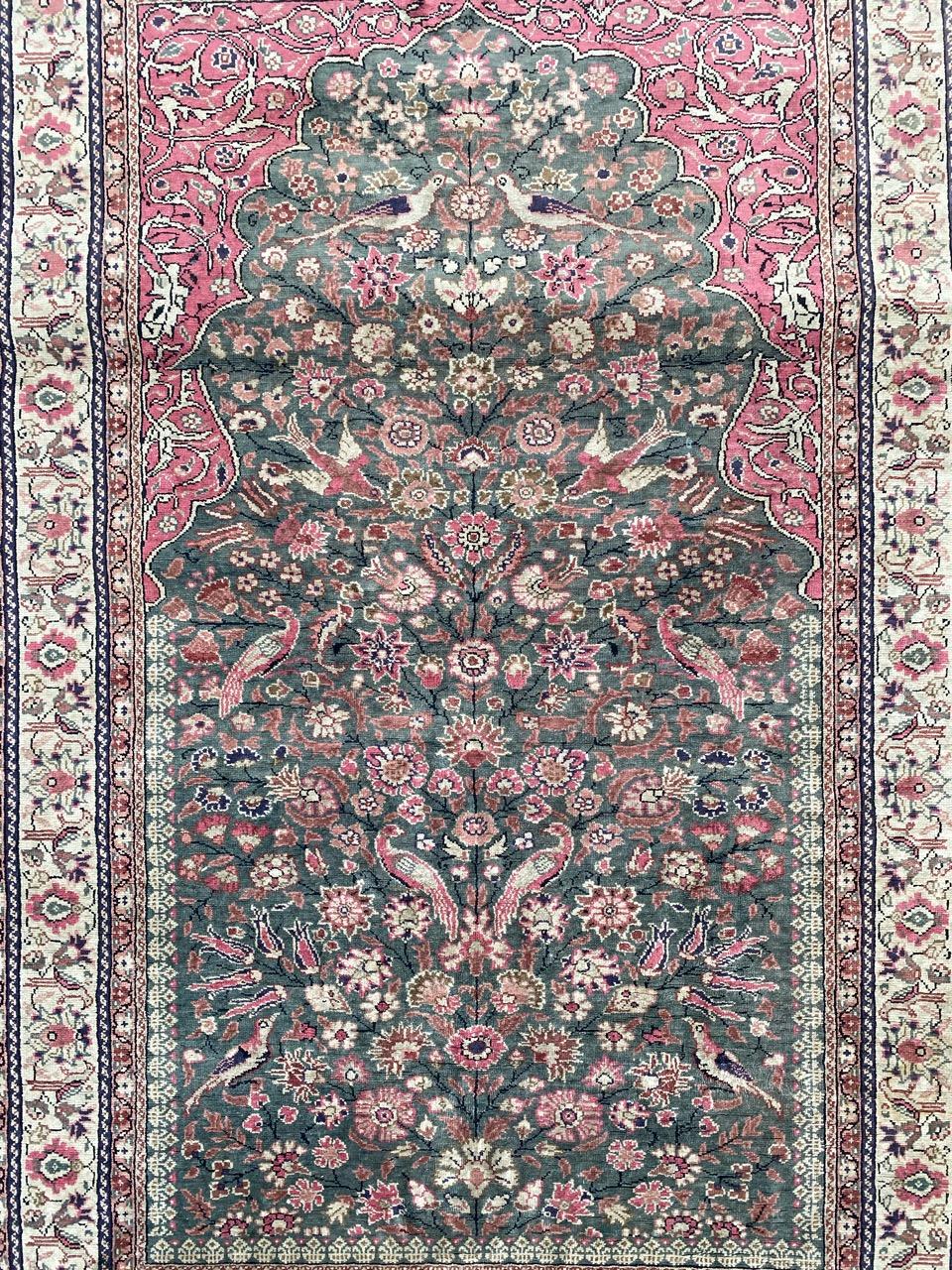 Pretty mid century Turkish silk Kayseri rug with nice floral design and beautiful colors with a green field color, entirely and finely hand knotted with silk and cotton velvet on cotton foundation.