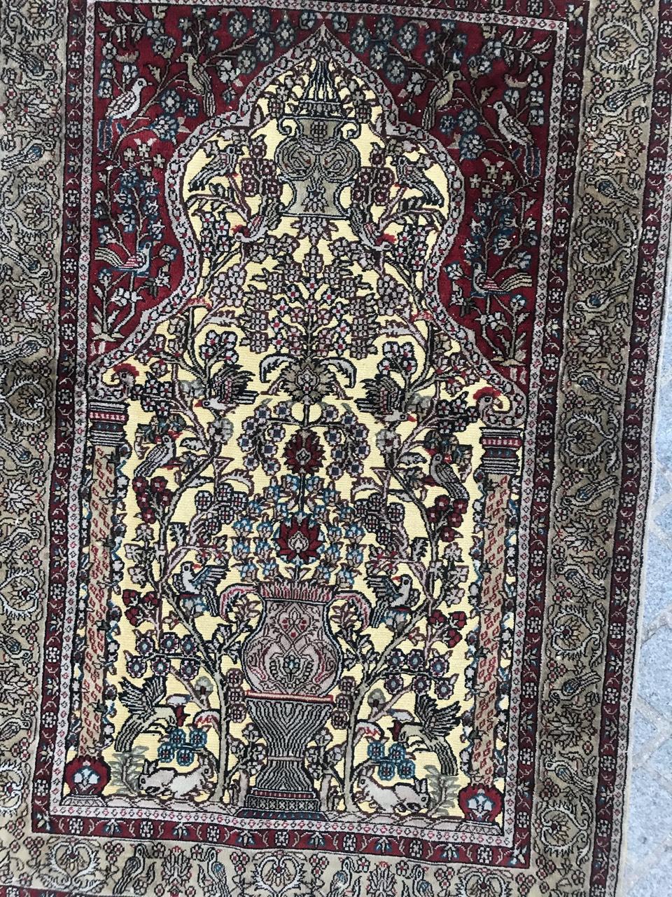 Very beautiful late 20th century Hereke style silk and gold rug with a mihrab prayer design and light colors with red and yellow, entirely hand knotted with silk velvet on silk foundation and golden threads embroidered.
  