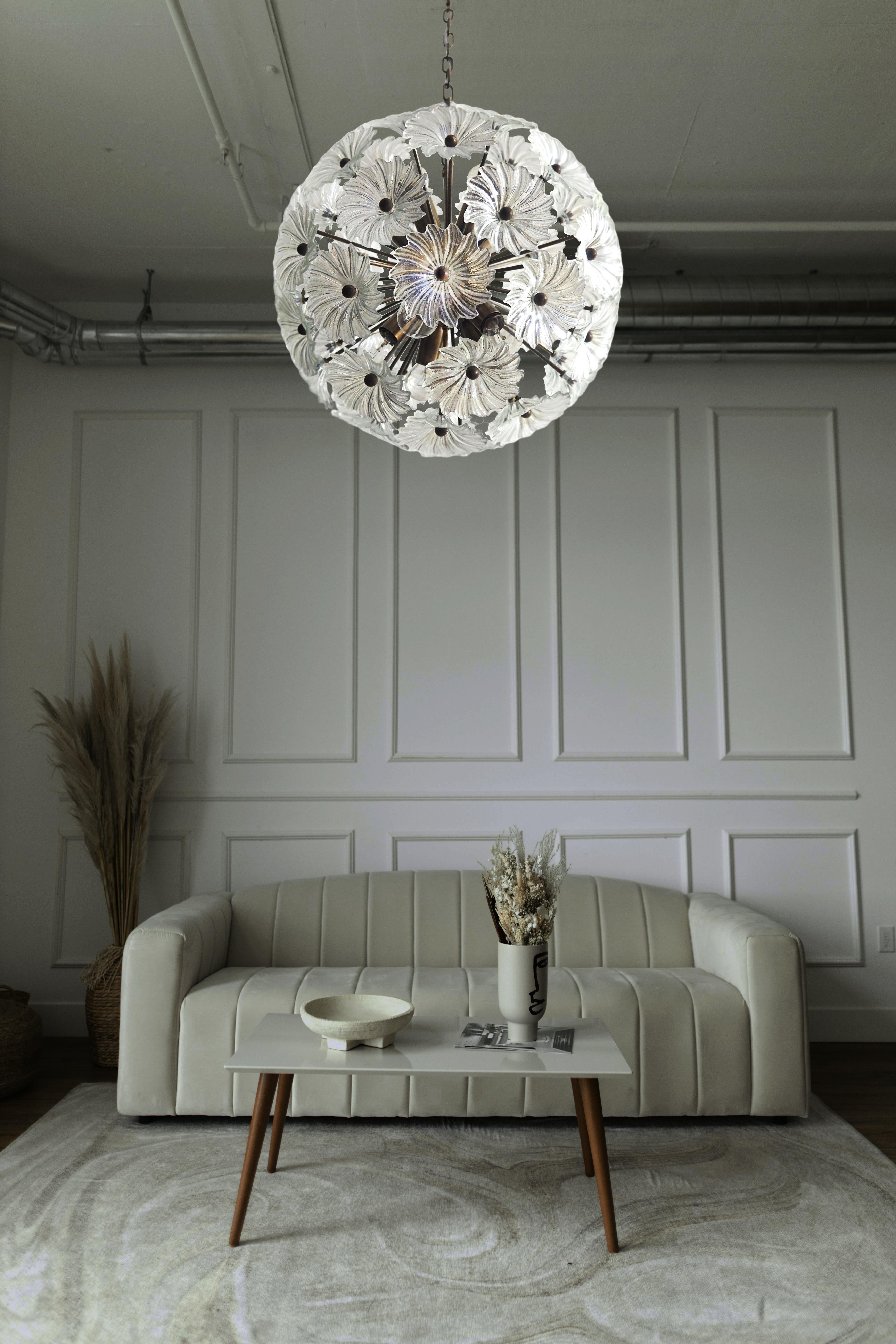 Sputnik space age Italian vintage crystal chandelier made by 51 transparent crystals in a burnished brass metal frame. Elegant lighting object.
Period: late XX century
Dimensions: 39 inches (100 cm) height with chain; 17,70 inches (45 cm) height