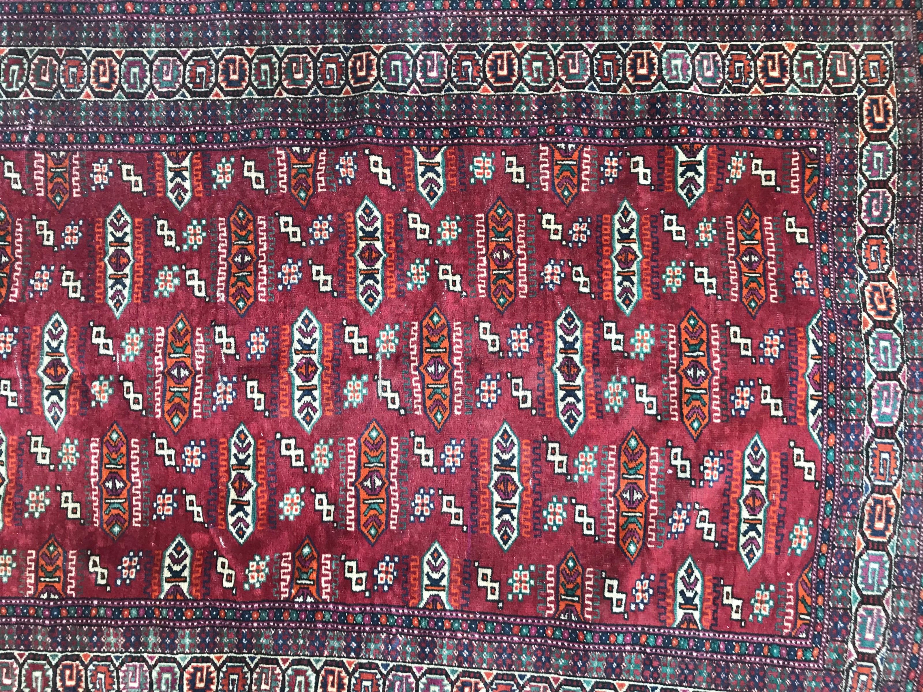 Nice late 20th century Turkmen rug with beautiful geometrical design and red field colors, finely hand knotted with wool on wool foundation.