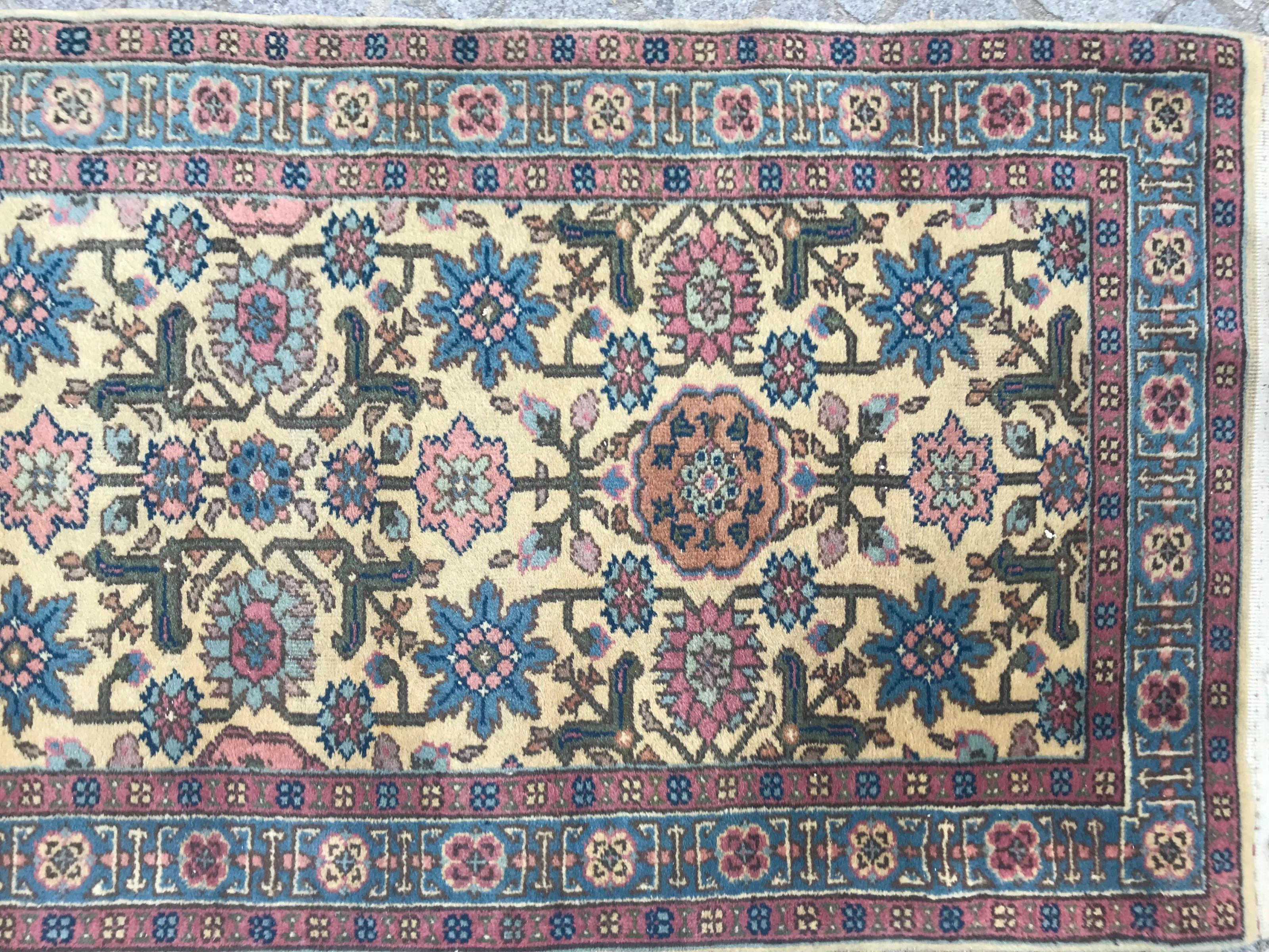 Nice decorative design mid-20th century runner with beautiful colors with yellow field, blue, green and pink, entirely hand knotted with wool velvet on cotton foundation.