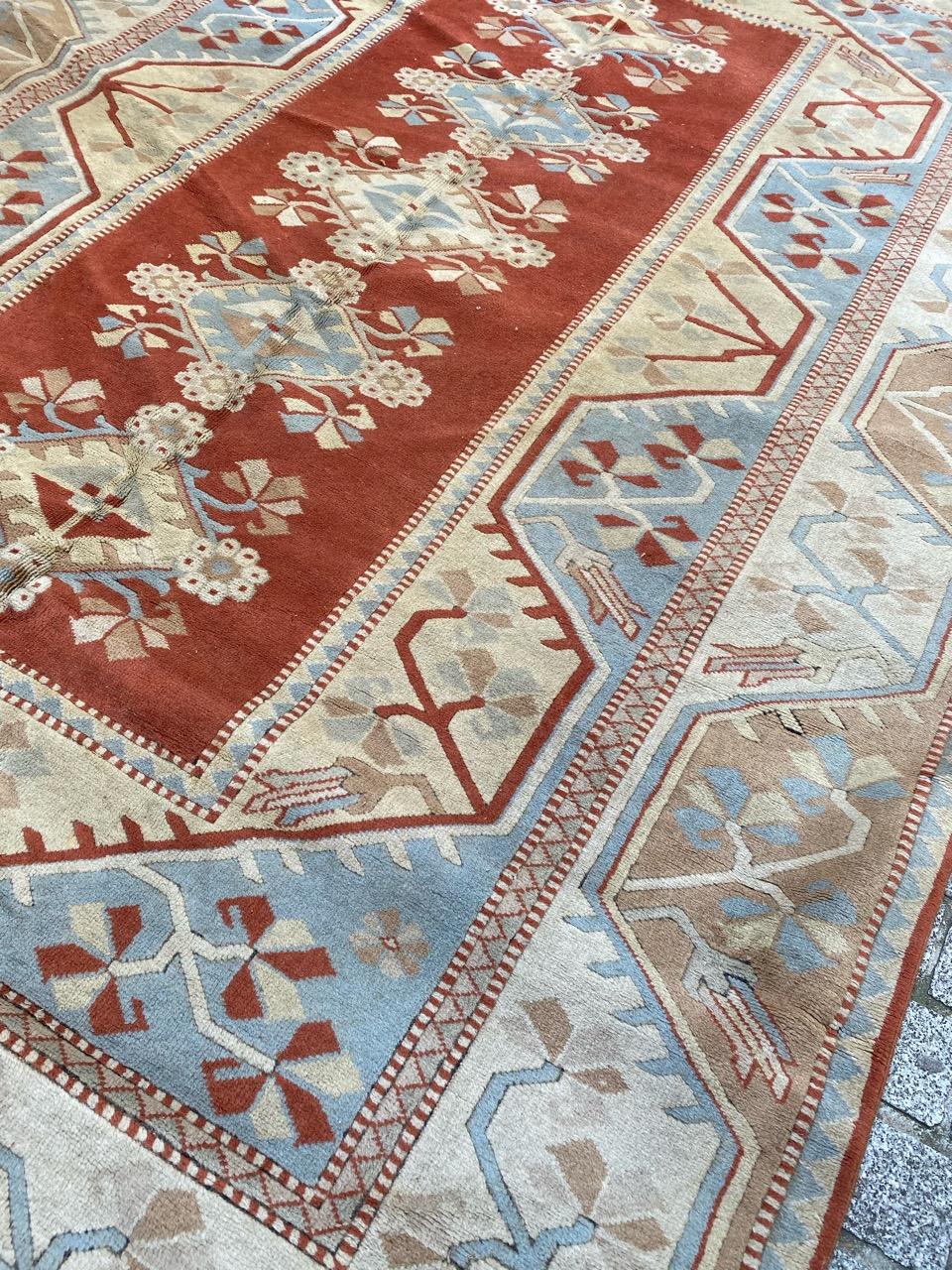 Nice large mid century Turkish rug with beautiful geometrical design and nice light colors, entirely hand knotted with wool velvet on wool foundation