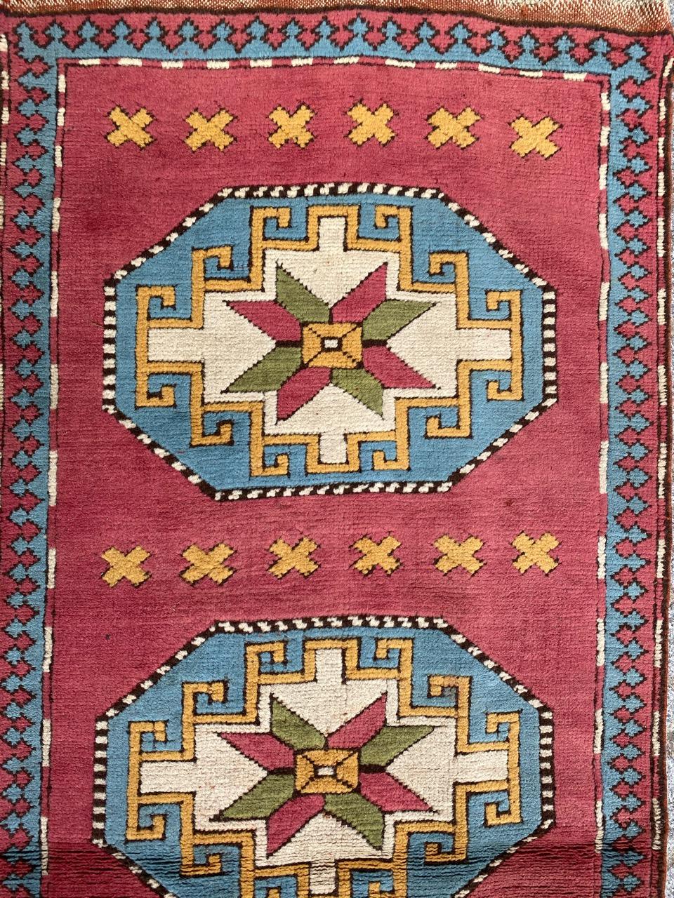 Very beautiful long corridor carpet from Turkey, Kars region, with pretty geometric and Caucasian designs, and pretty colors with a pink background, entirely hand-knotted in wool velvet and wool foundation.