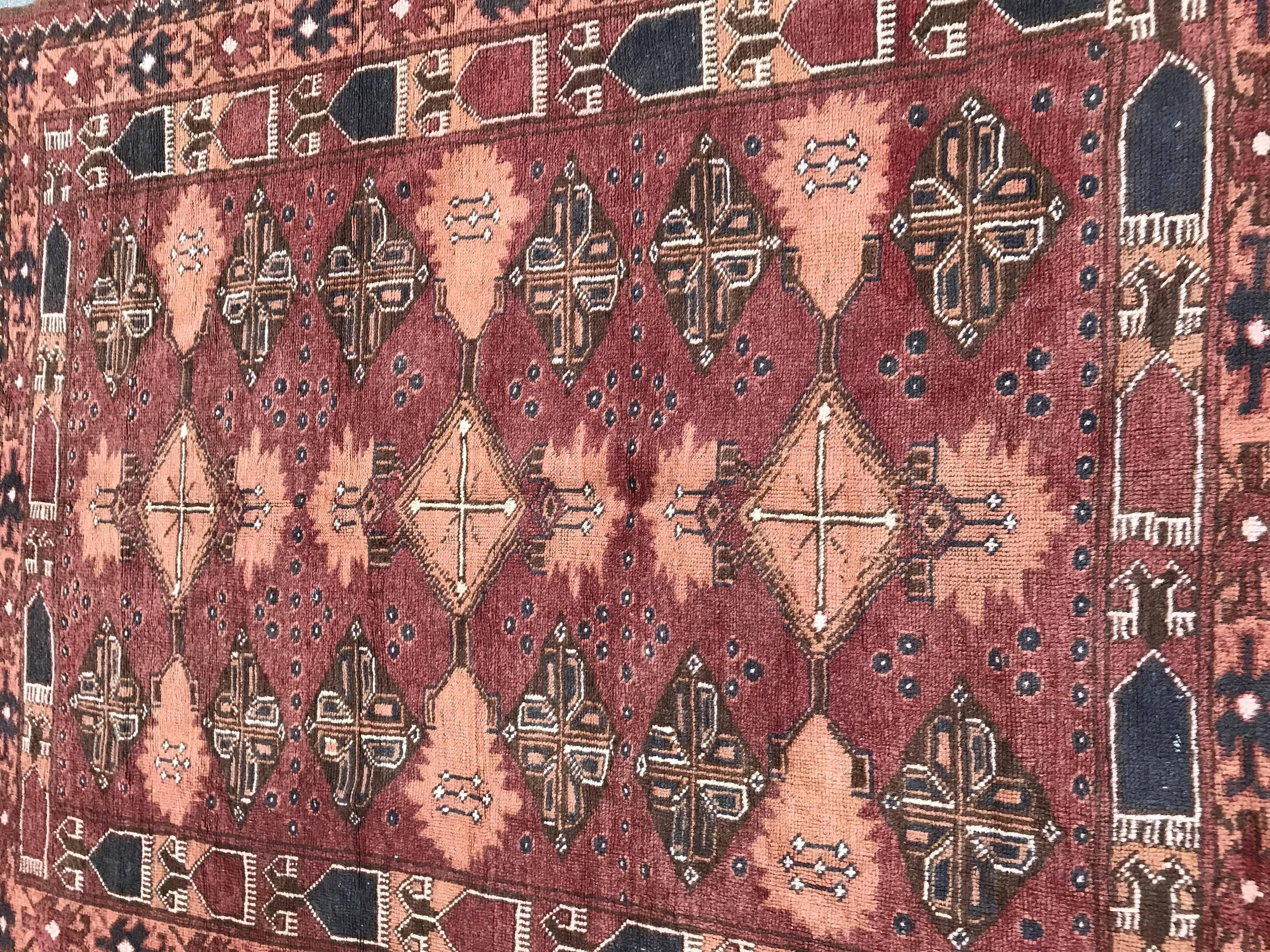 Very beautiful fine Turkmen rug from Afghanistan with a tribal design and nice colors, entirely hand knotted with wool velvet on wool foundation, in good conditions, second half of the 20th century.