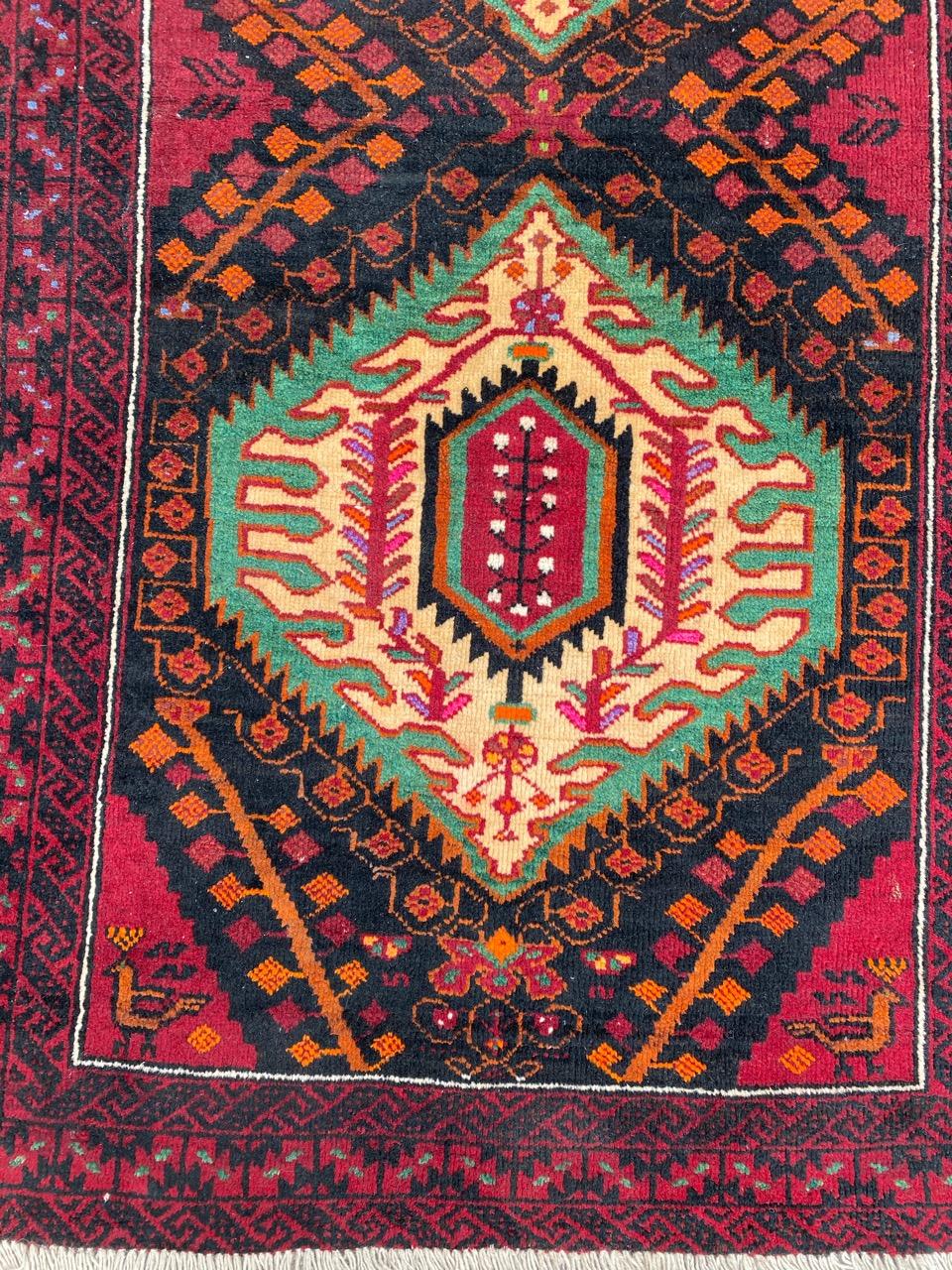 Nice midcentury Baluch rug with beautiful geometrical design and nice colors, entirely hand knotted with wool velvet on wool foundation.