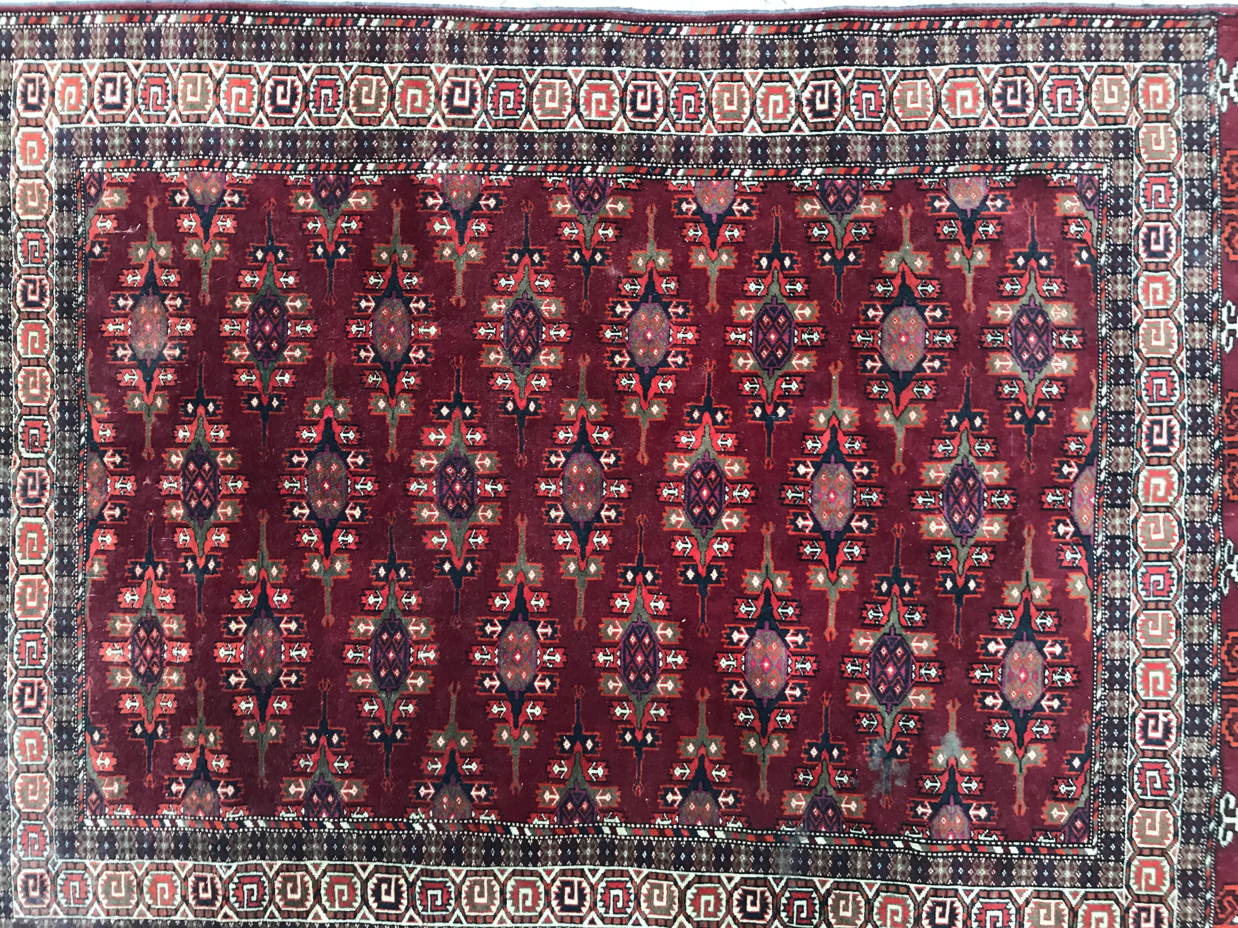 Nice mid-20th century Turkmen rug with a beautiful Tekke design and red, pink, purple and blue colors, finely hand knotted with wool velvet on wool foundation.