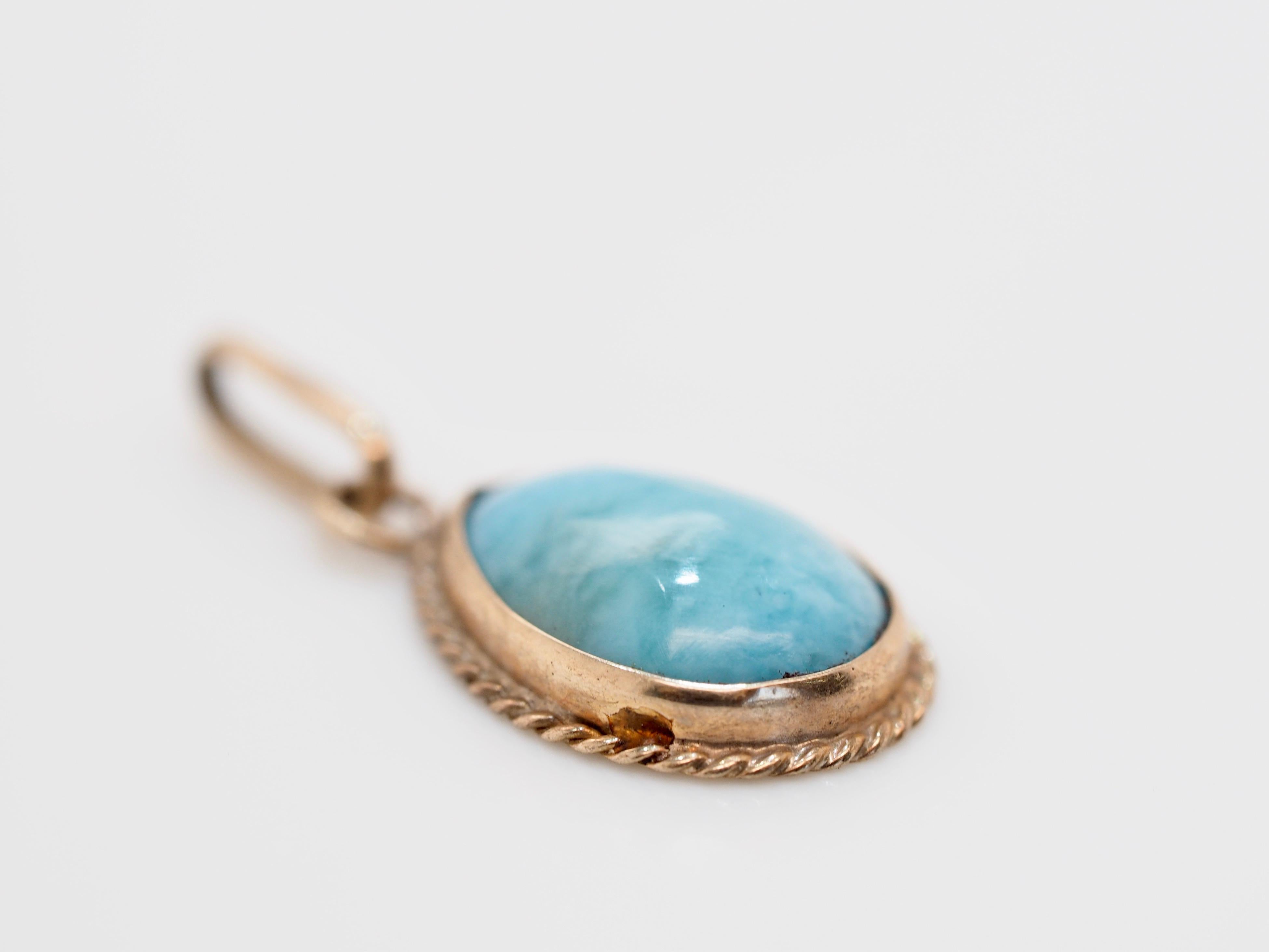 This charming little turquoise teardrop pendant would make a lovely addition to any vintage lovers jewelry collection. Featuring a natural turquoise cabochon teardrop wrapped in a classic 14K Yellow Gold rope styled bezel. With the addition of a 14K