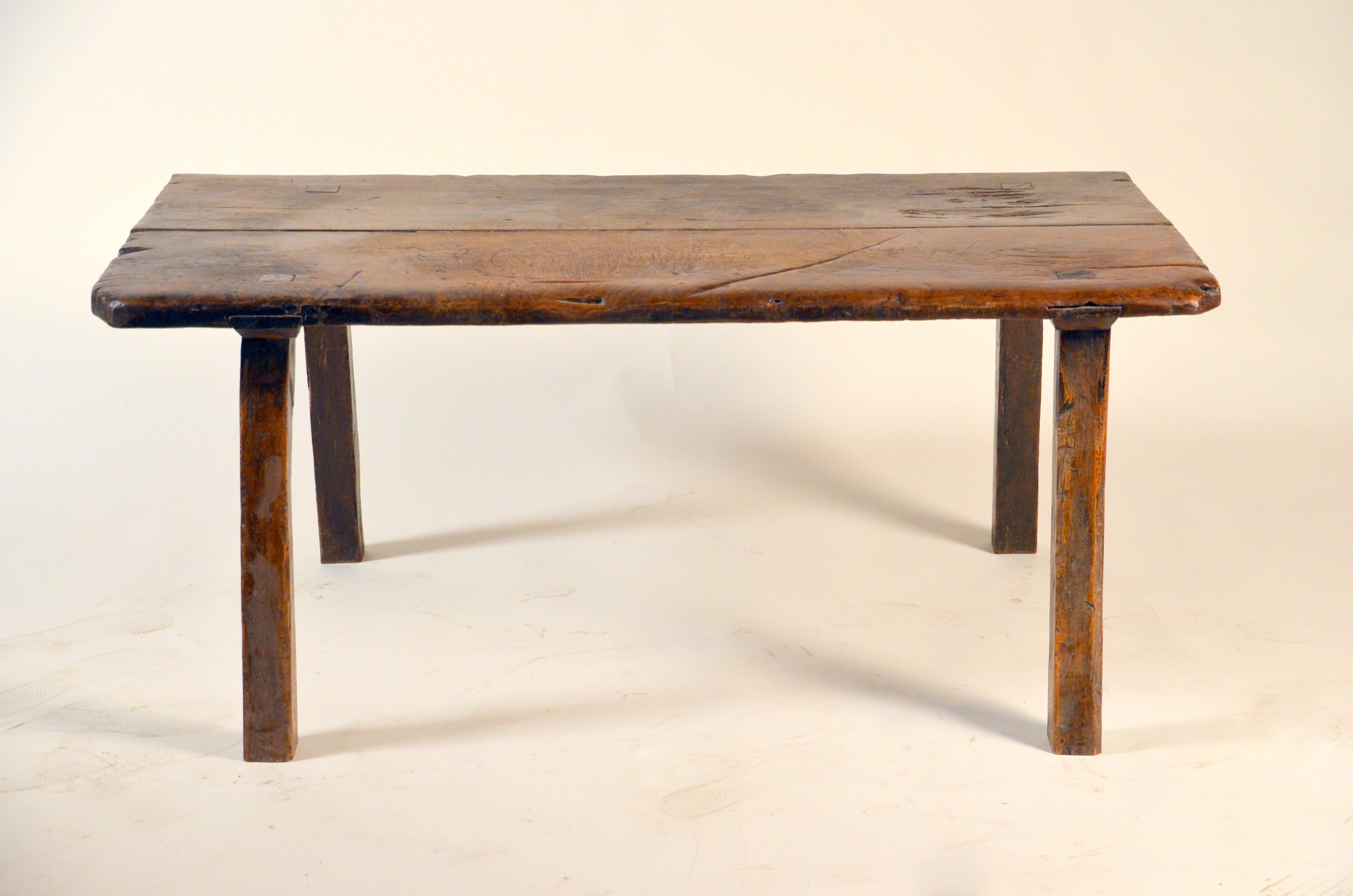 Beautiful Wabi coffee table. Hardwood slab with amazing patina. 4 angled legs.

The last 2 photos are to give an idea of the table in a project setting.