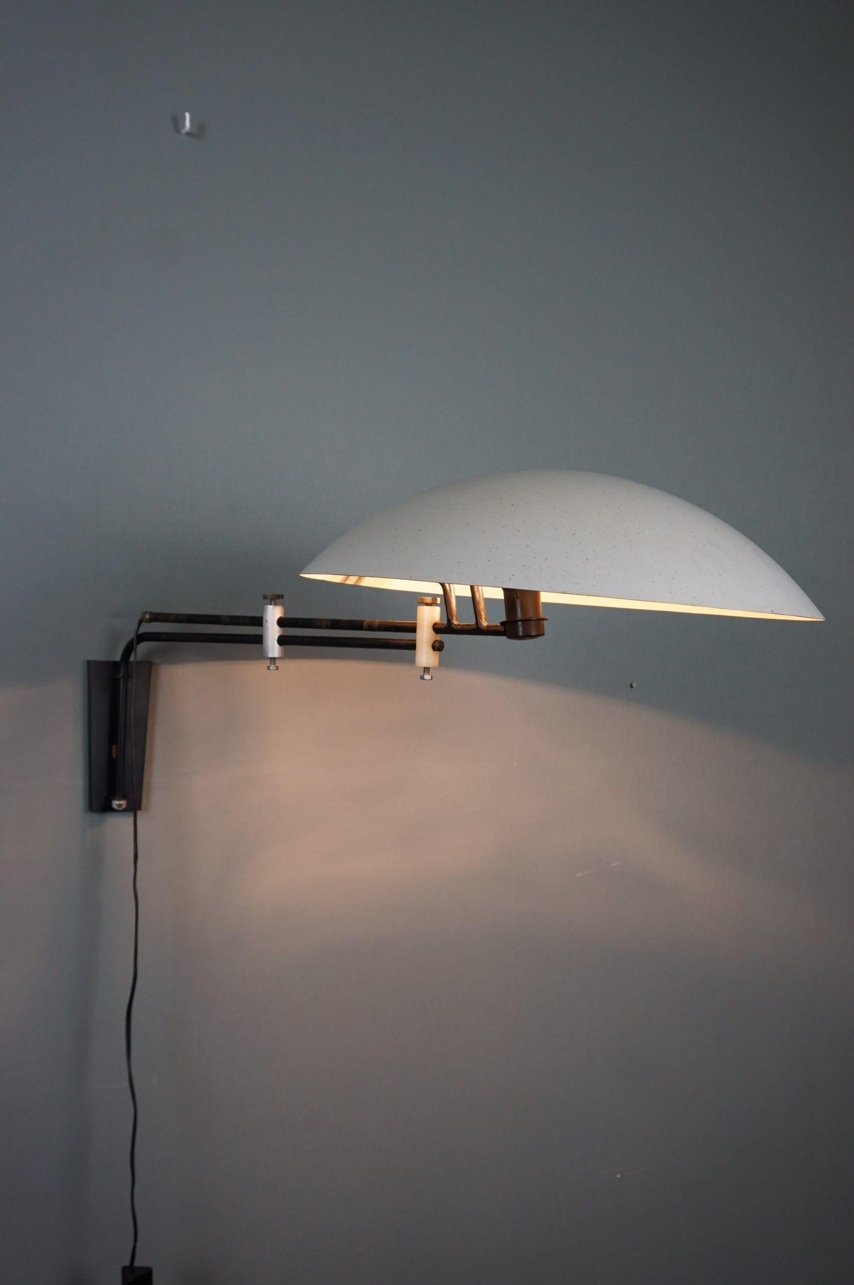 This lamp designed by Louis Kalff for Philips in 1957 is a true design icon. This model, which is more than 60 years old, is still a modern lamp even today.

This adjustable wall lamp designed in 1958, model NX23, is truly fantastic in design. The