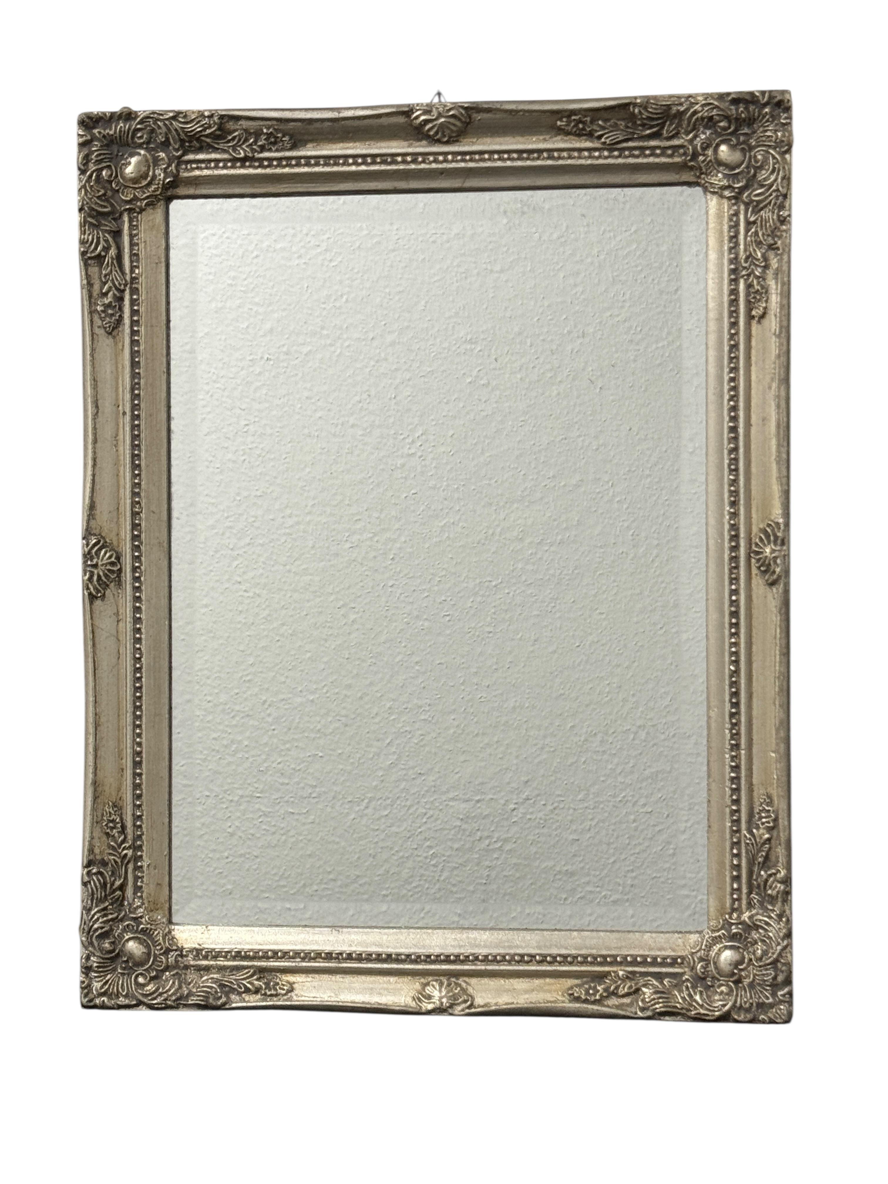 A stunning beautiful mirror in a antique silvered frame. Age circa 1960s or older. With signs of wear as expected with age and use. Obviously this item is not new, so please check all photos before purchase. A nice addition to any room. Found at an