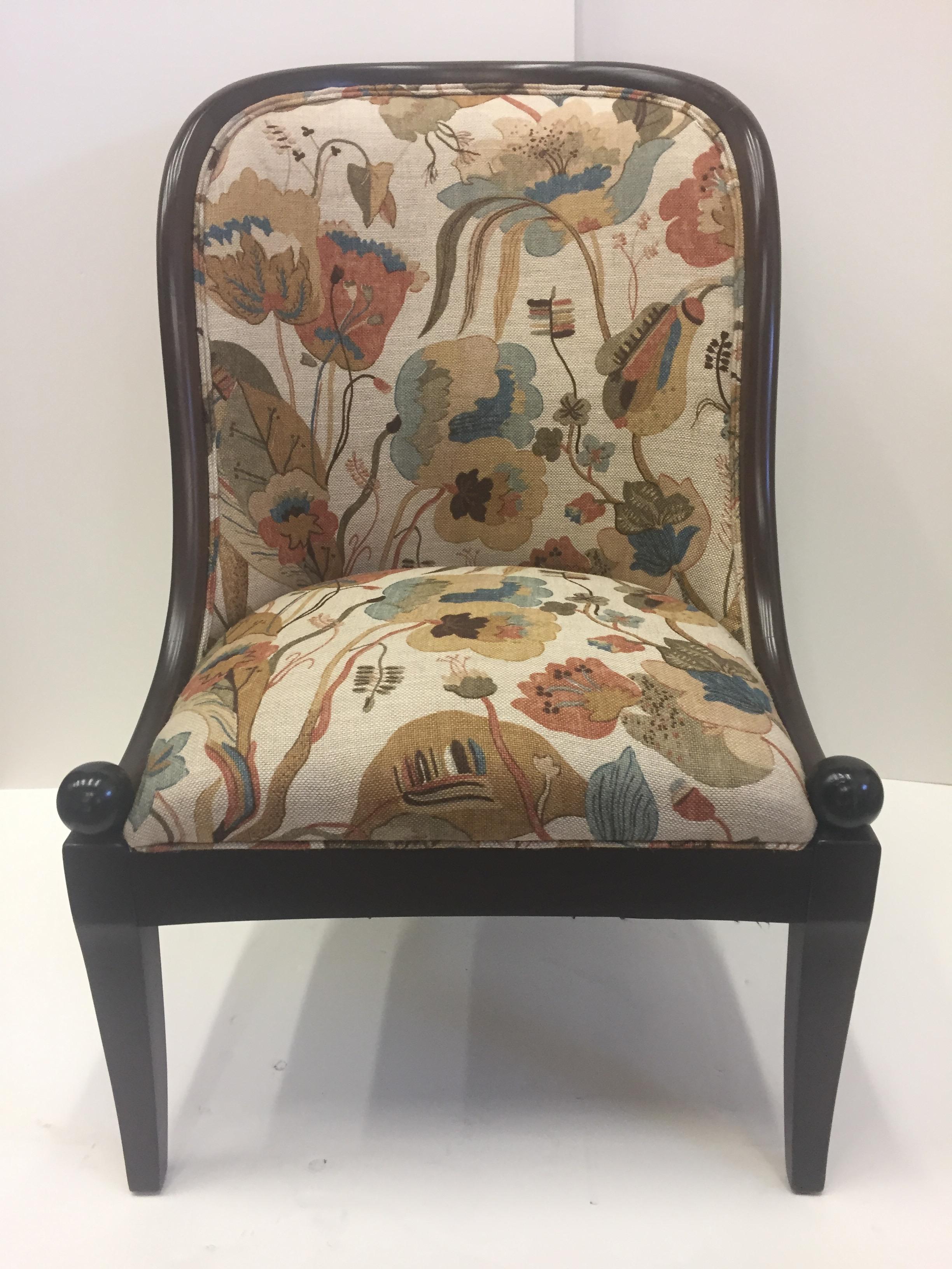 Fine barrel shaped club chair by Baker with gorgeous shape and Baker upholstery having
a contemporized floral pattern in earth tones. 

Measures: seat height 17.