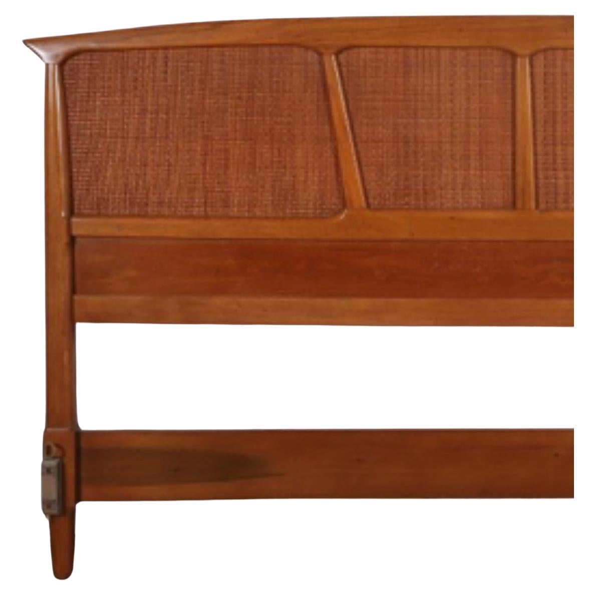 Beautiful walnut sculpted cane King size bed headboard. Arched top with sculpted walnut structure with caning through out. Very stunning King size headboard. Made by Tomlinson. Made in USA. Located in Brooklyn NYC. 

Headboard only no bed frame or