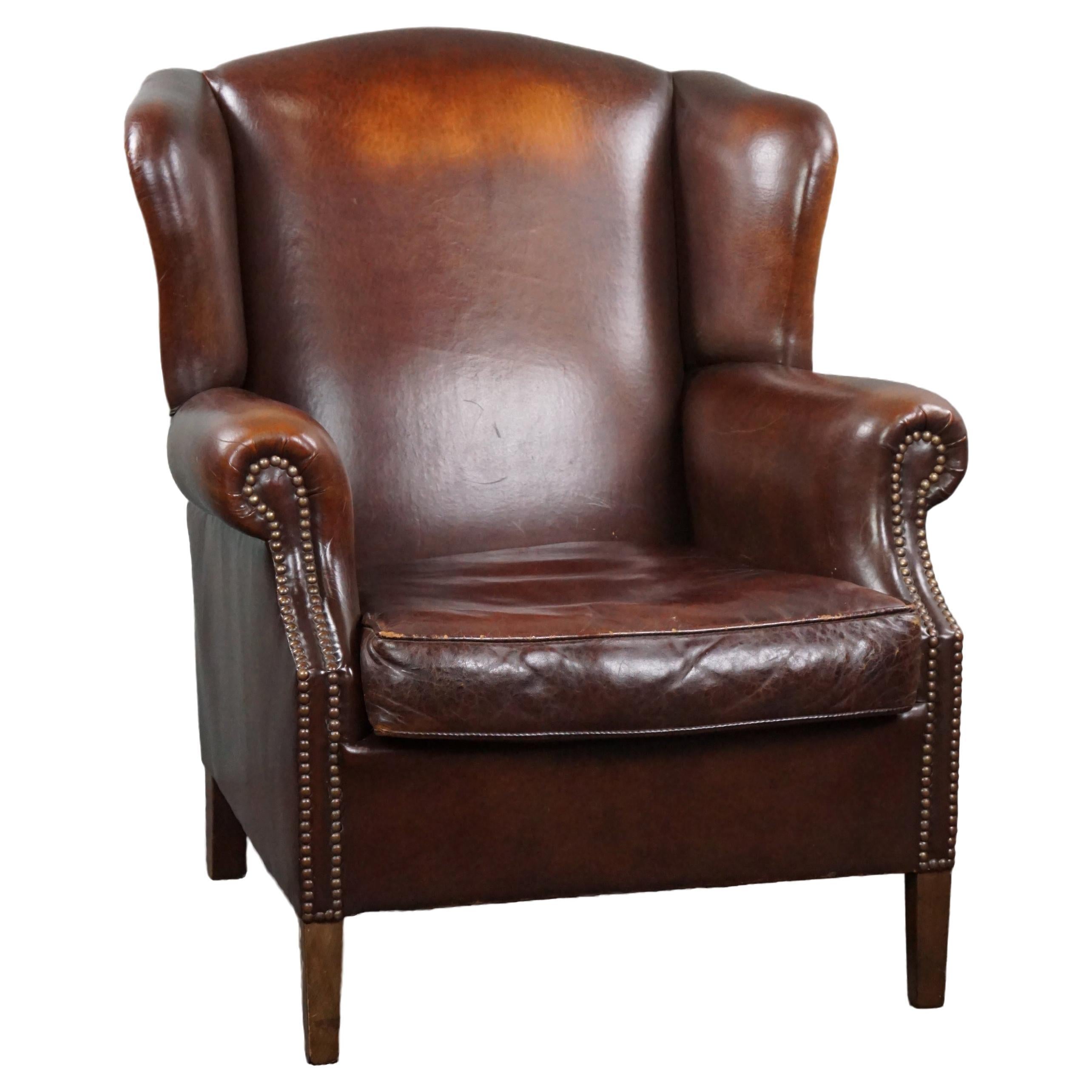 Beautiful warm-colored sheep leather wing chair For Sale